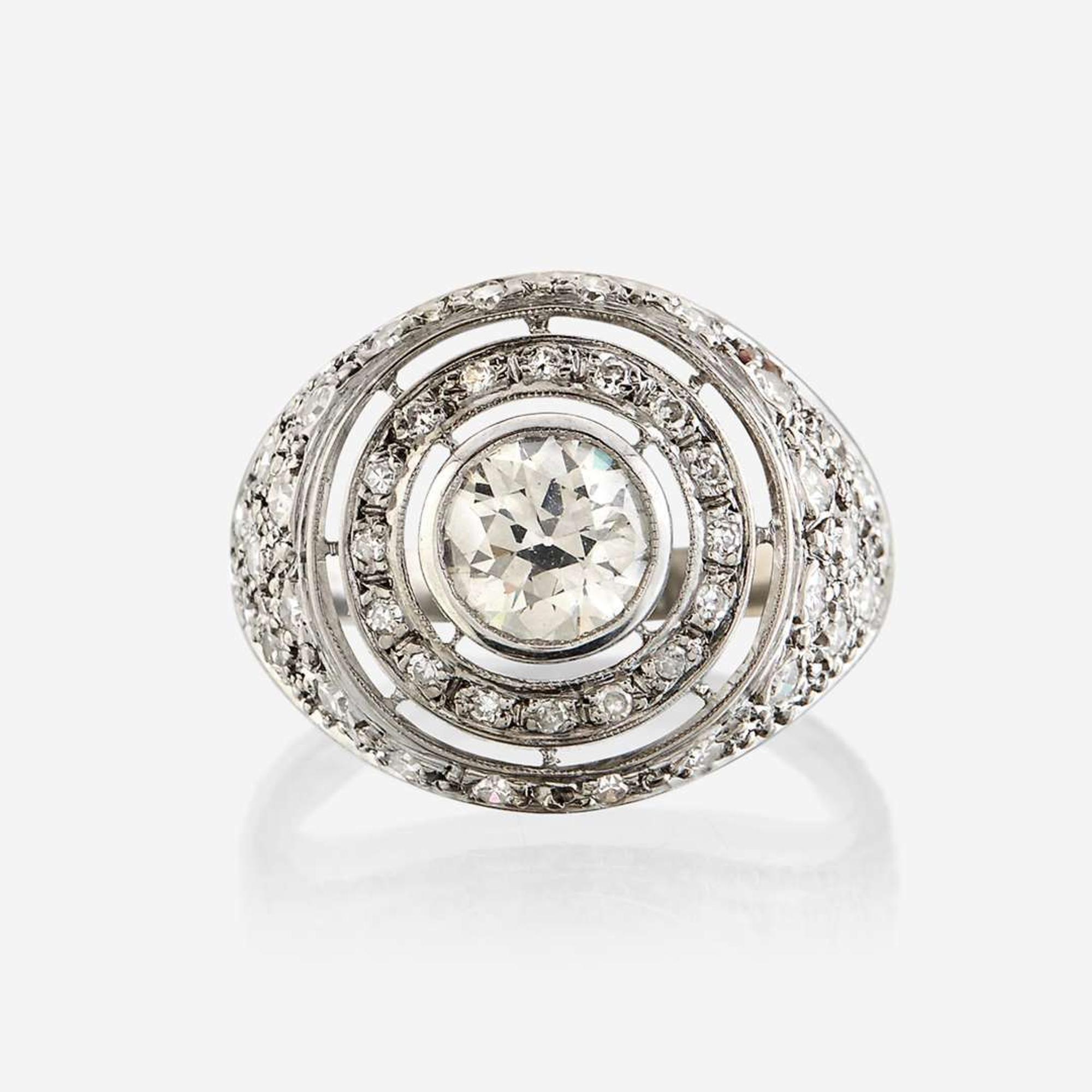A diamond and eighteen karat white gold ring