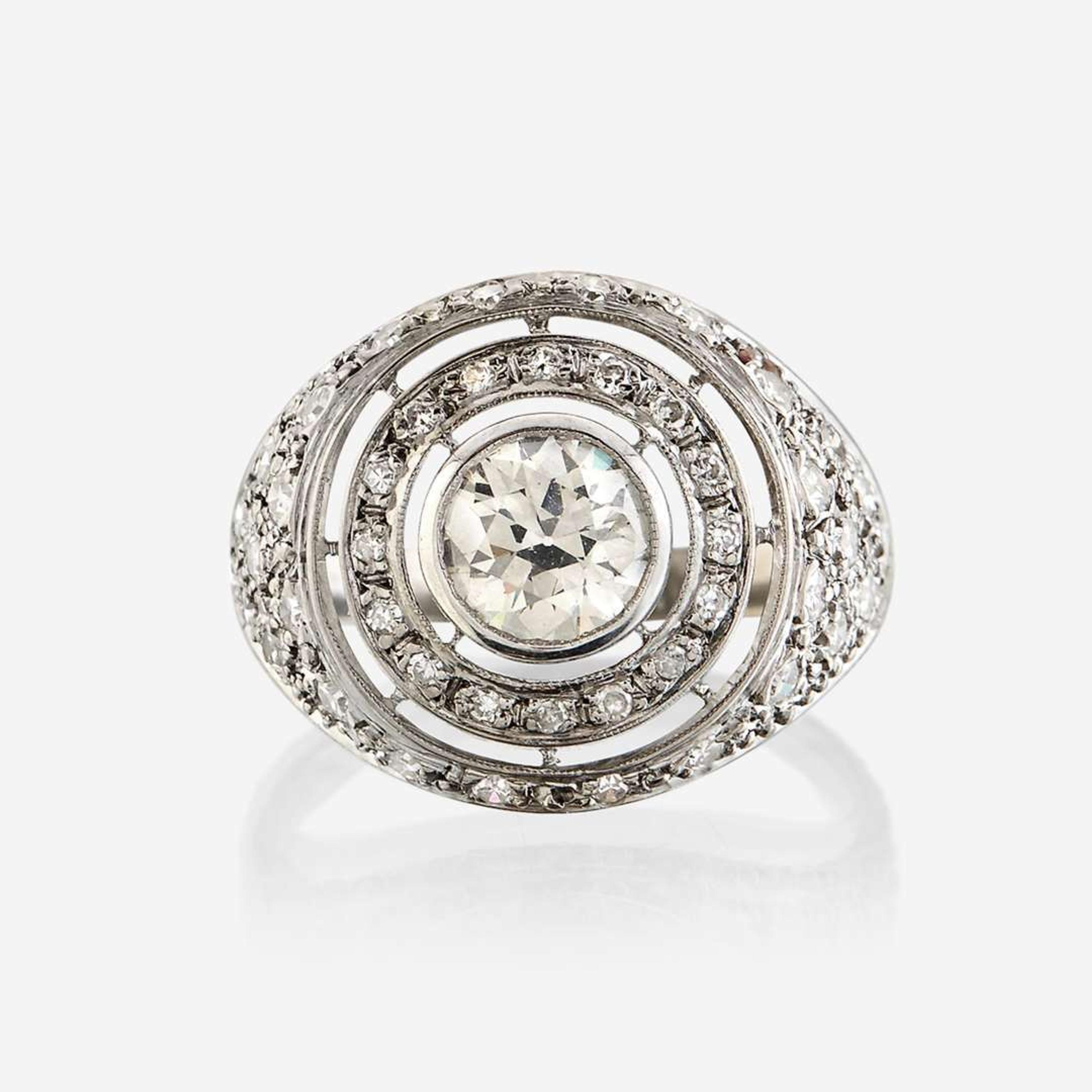 A diamond and eighteen karat white gold ring