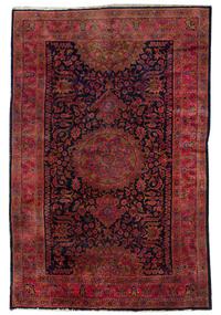 A Sarouk Wool Rug, 7 feet x 10 feet 1 inch.