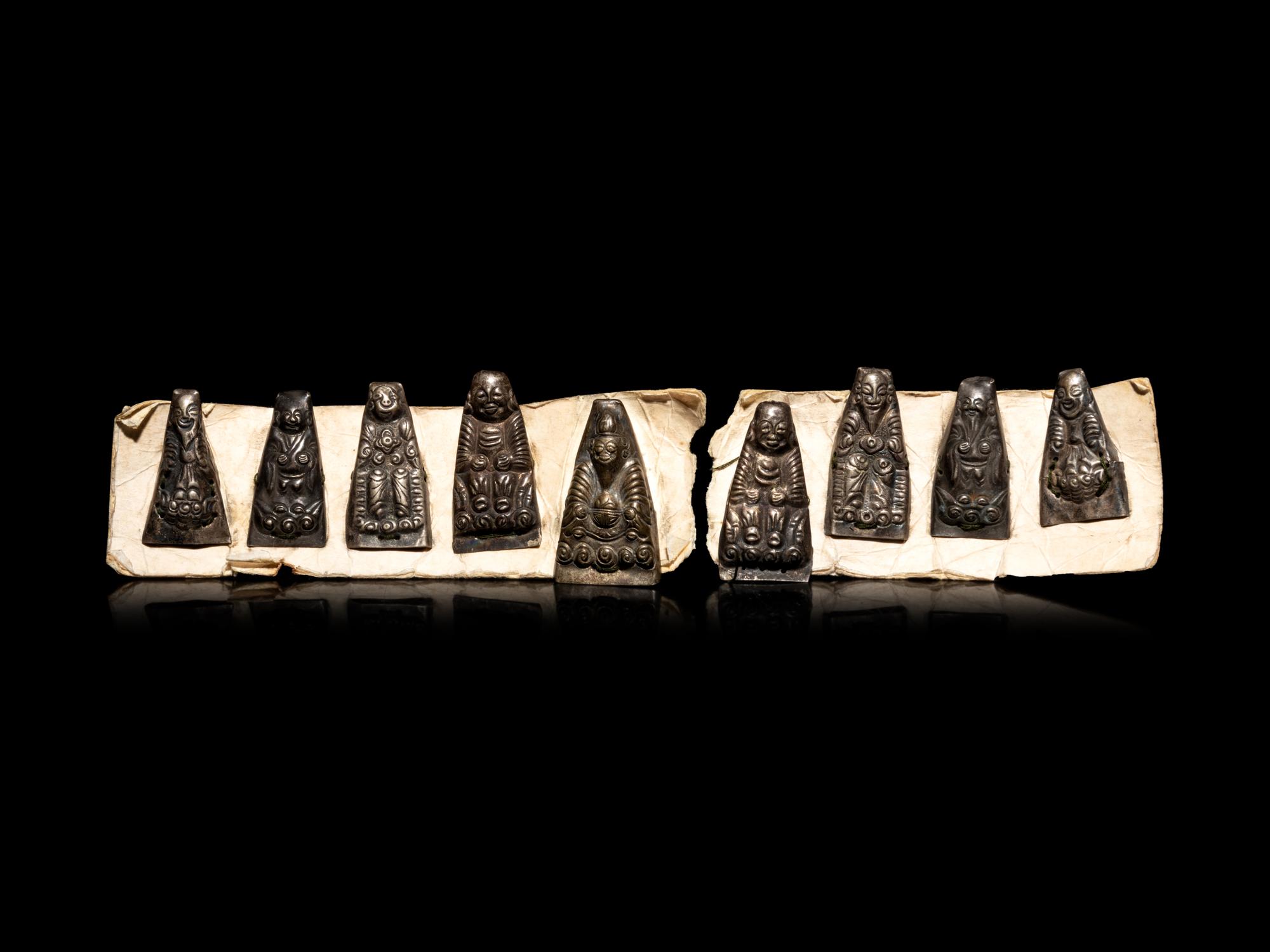 Nine Small Southeast Asian Silver Buddhist Votives