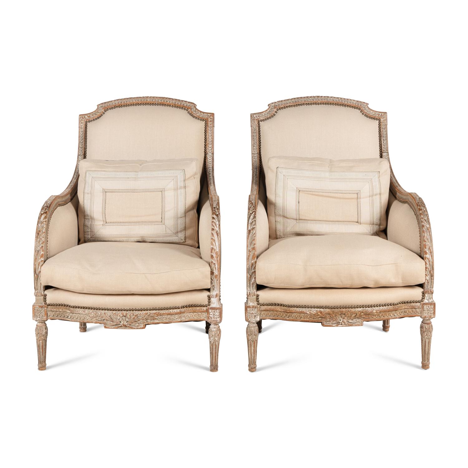 A Pair of Louis XVI Carved and Painted Bergères