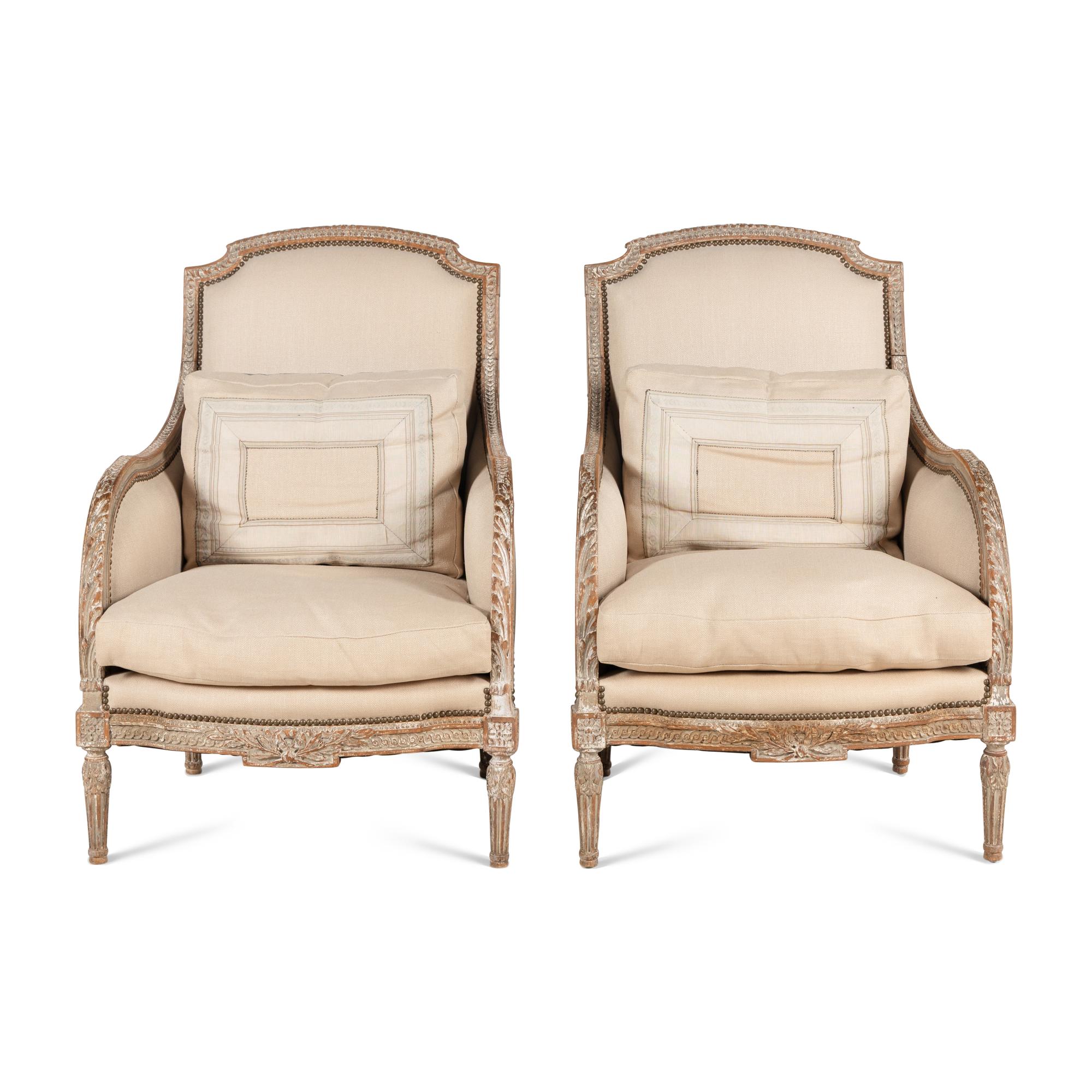 A Pair of Louis XVI Carved and Painted Bergères