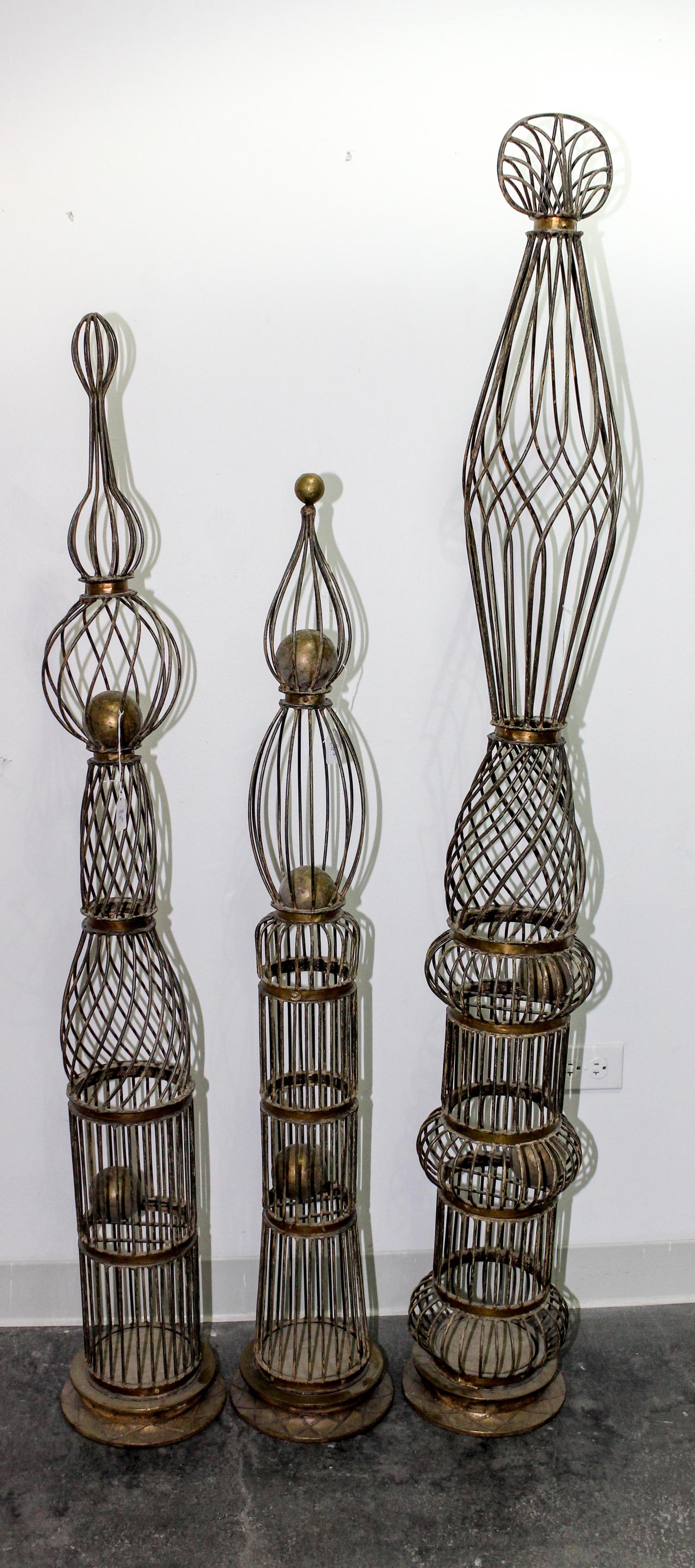 A Set of Three Topiary Forms Height of tallest 64 1/2 inches.