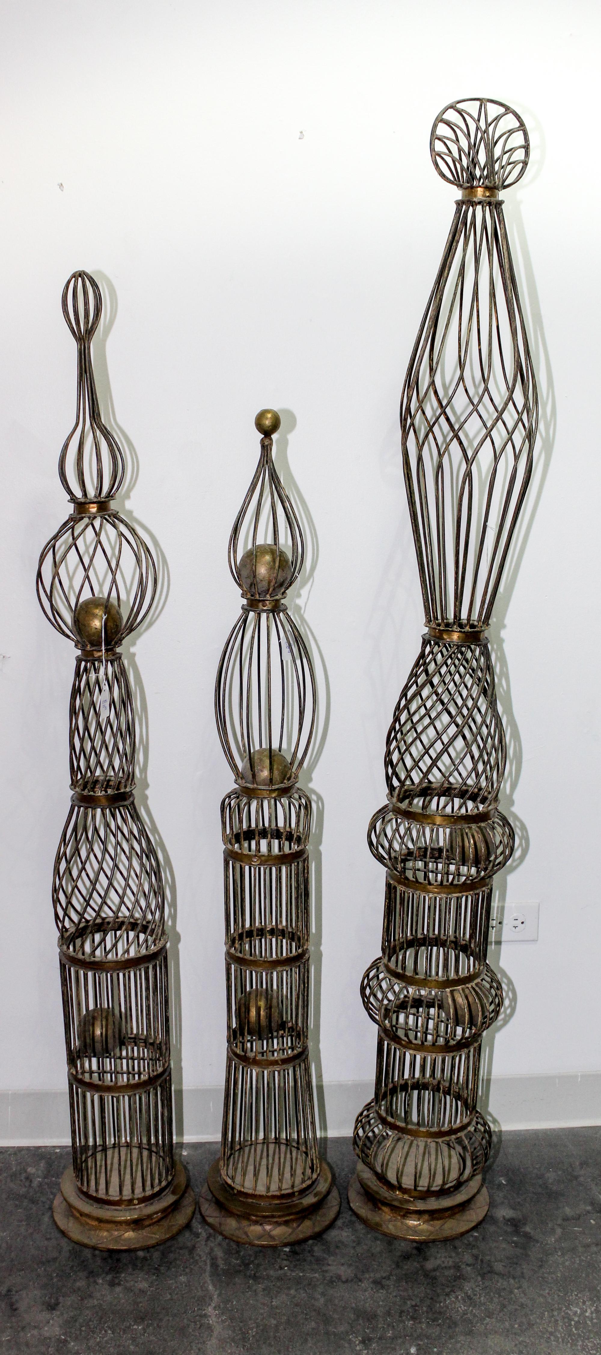 A Set of Three Topiary Forms Height of tallest 64 1/2 inches.