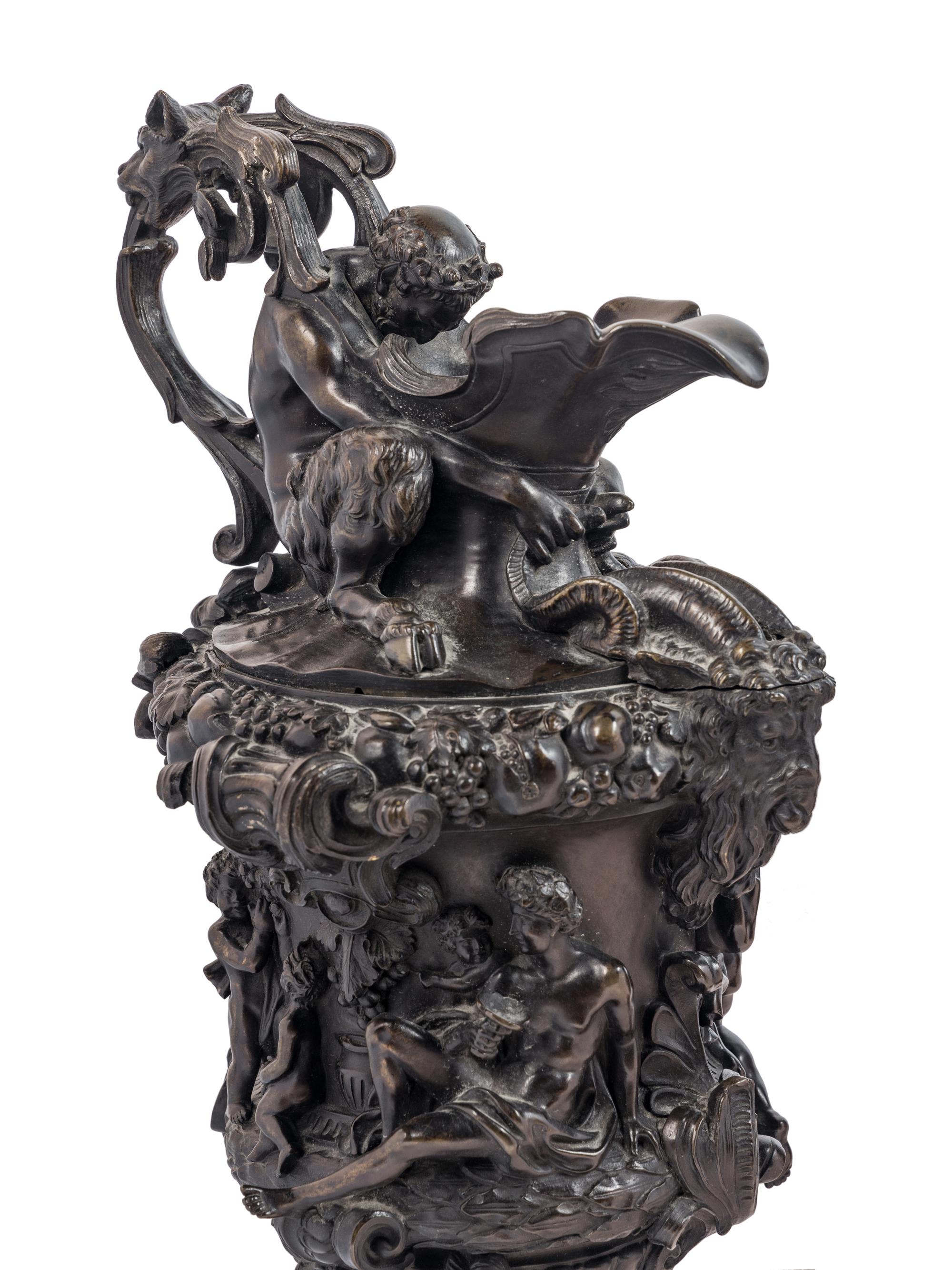 A Pair of Grand Tour Bronze Ewers Emblematic of Water and Earth