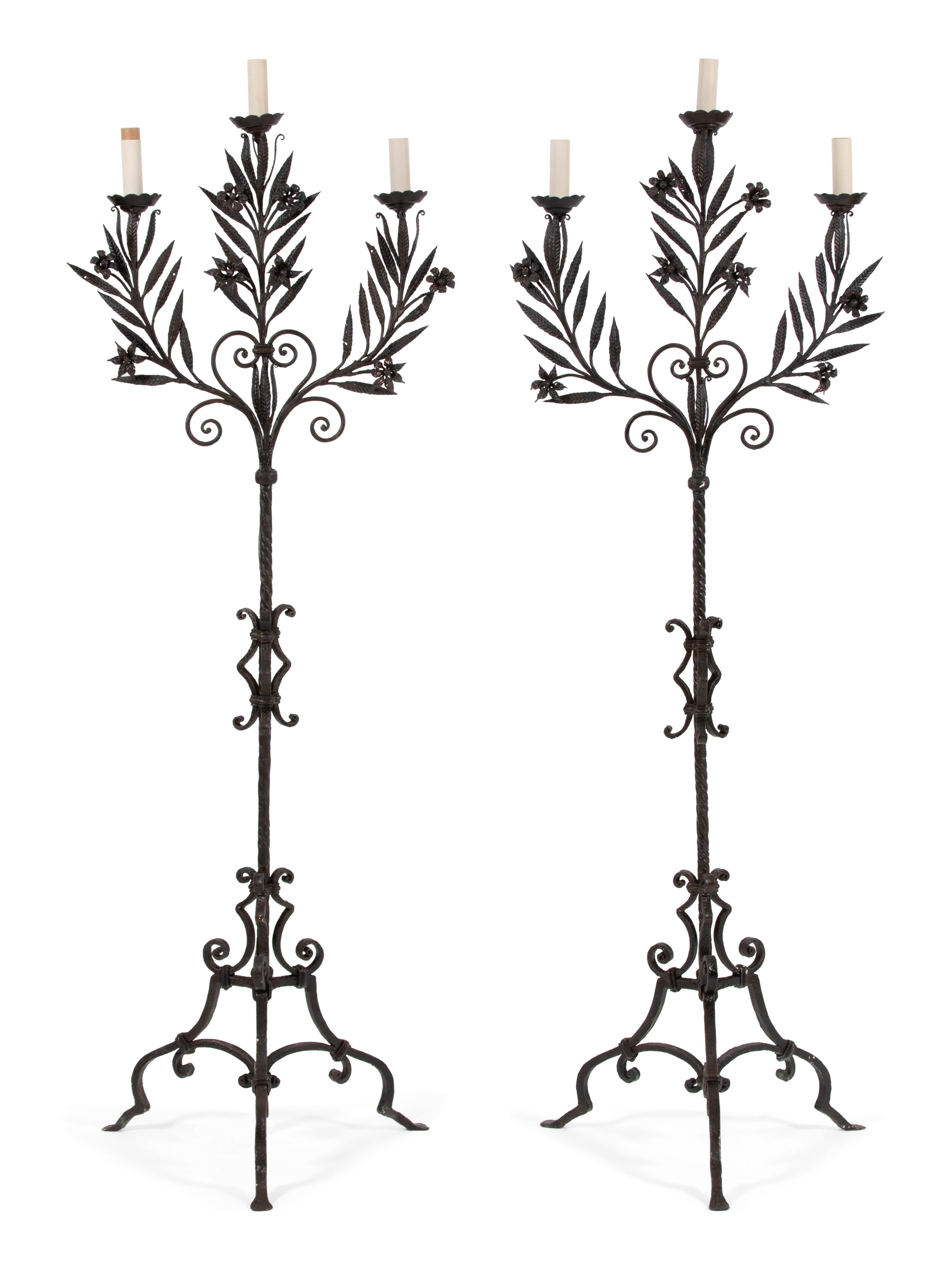 A Pair of Mizner Style Three-Light Wrought Iron Torcheres — FIRST QUARTER 20TH CENTURY