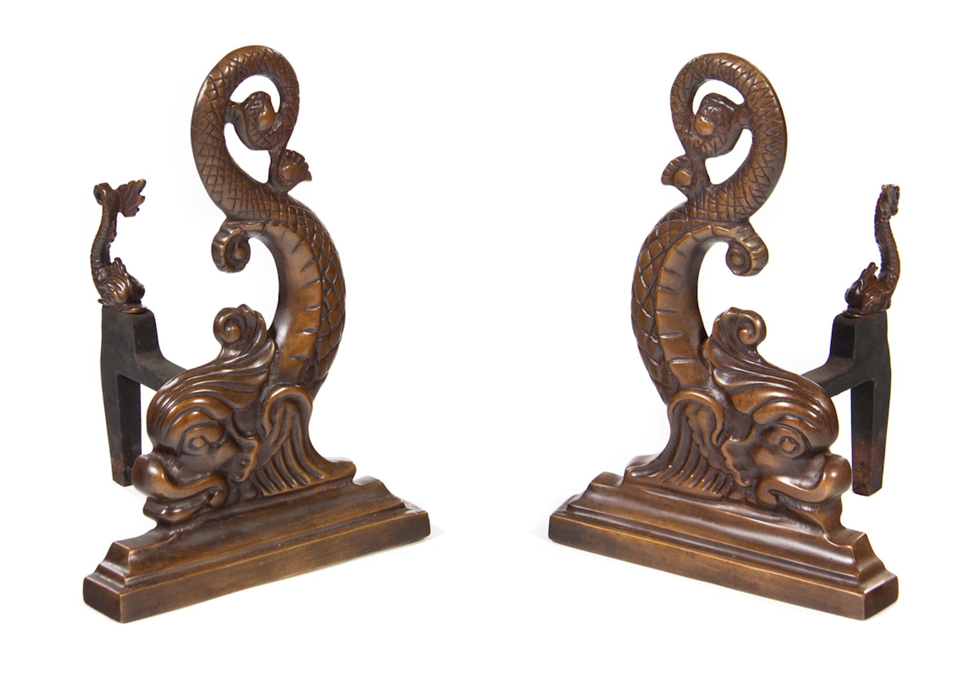 A Pair of Dolphin-Form Andirons and a Fender