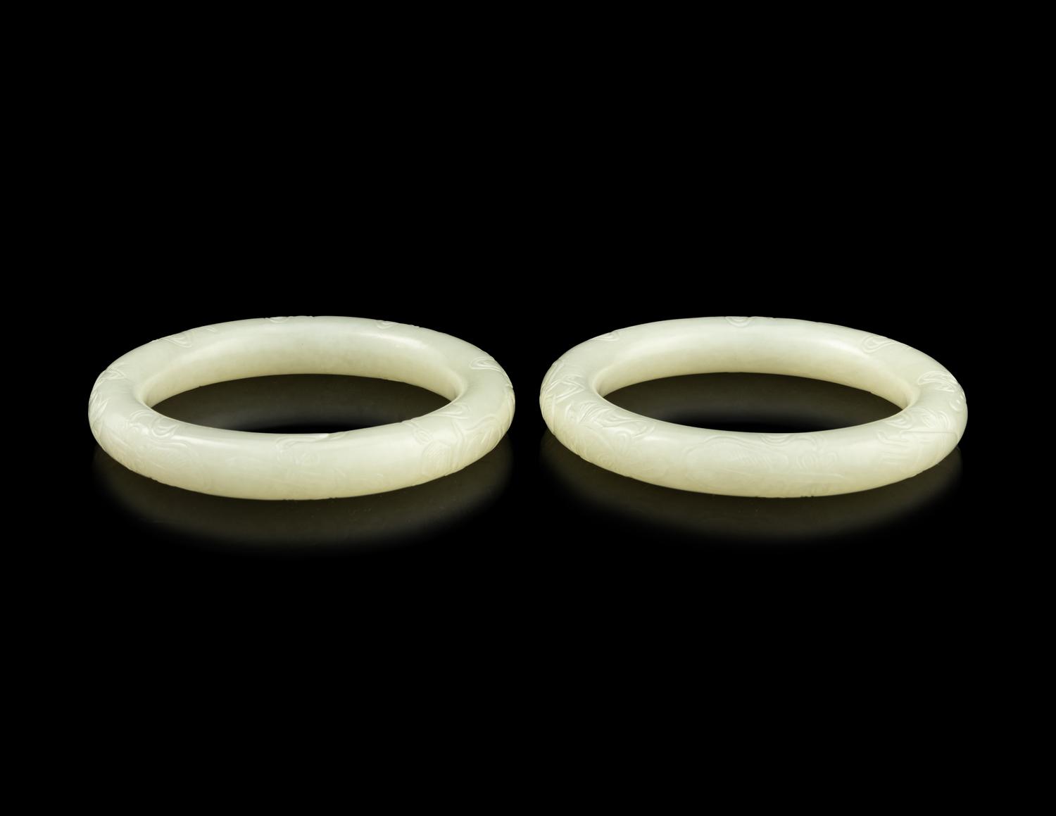 A Pair of Carved White Jade Bangles