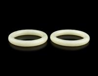 A Pair of Carved White Jade Bangles