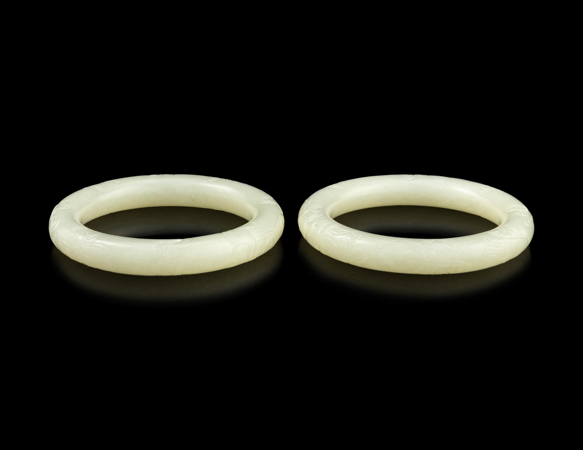 A Pair of Carved White Jade Bangles