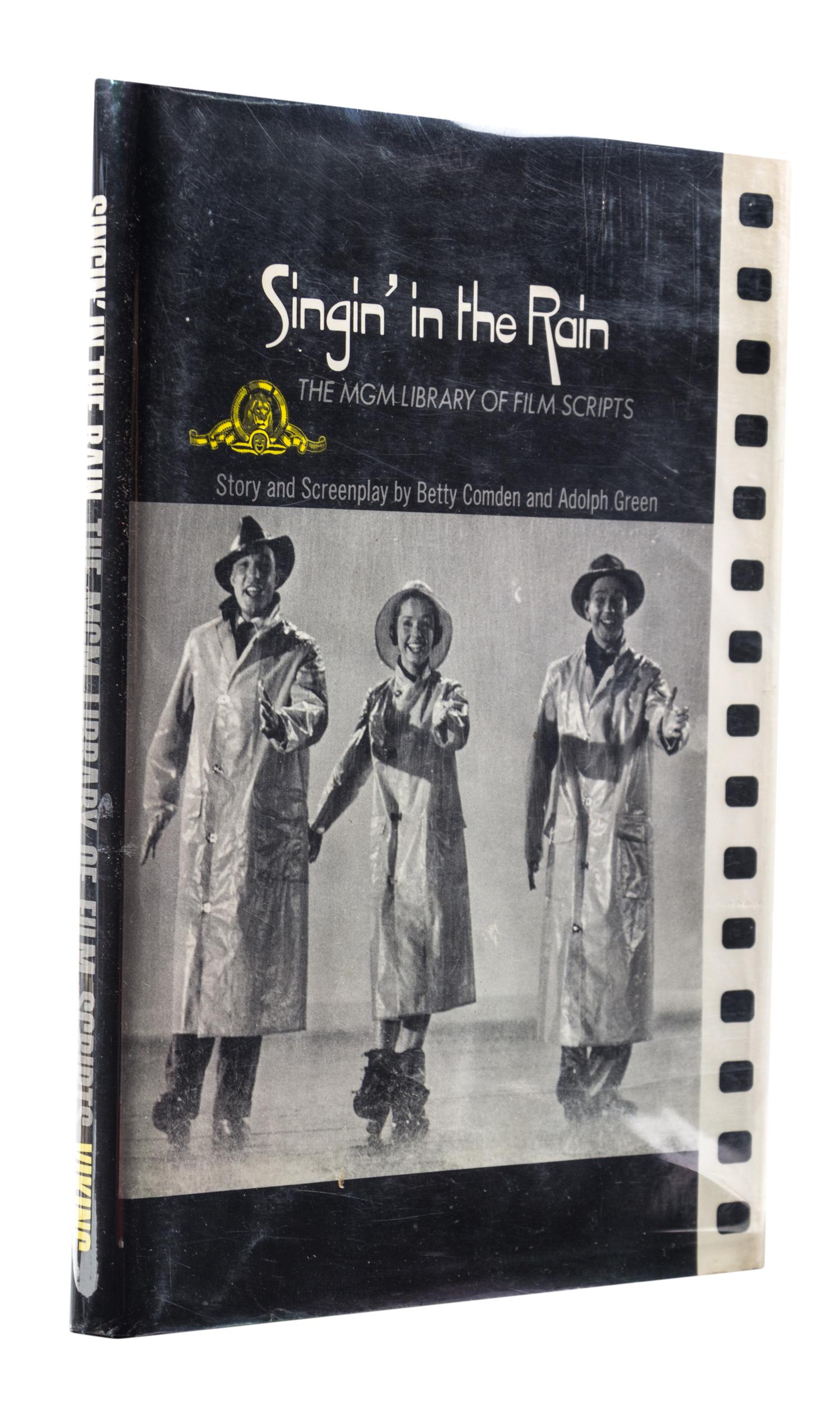 (COMDEN, BETTY AND ADOLPH GREEN) Singing in the Rain. New York, (1972). Inscribed by Comden and Green.