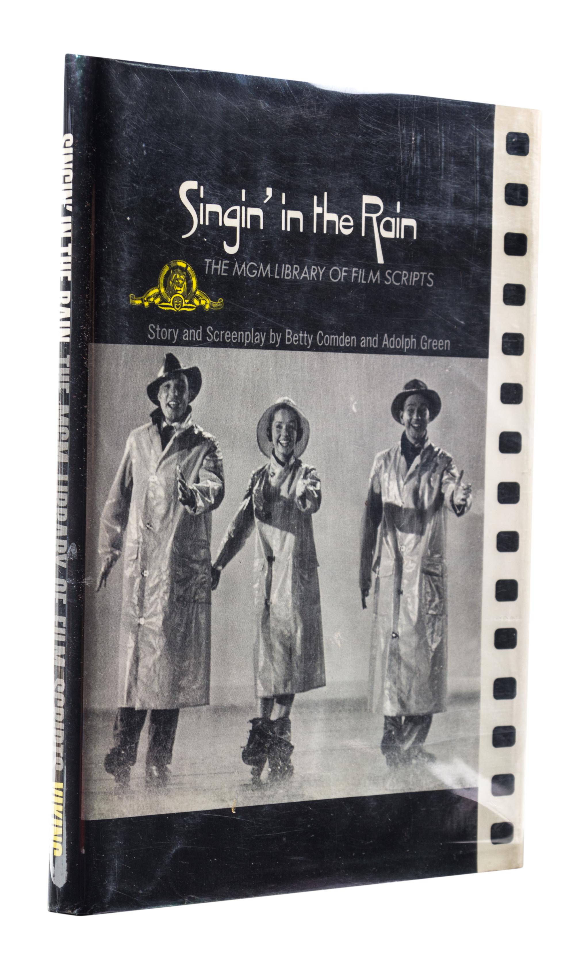 (COMDEN, BETTY AND ADOLPH GREEN) Singing in the Rain. New York, (1972). Inscribed by Comden and Green.