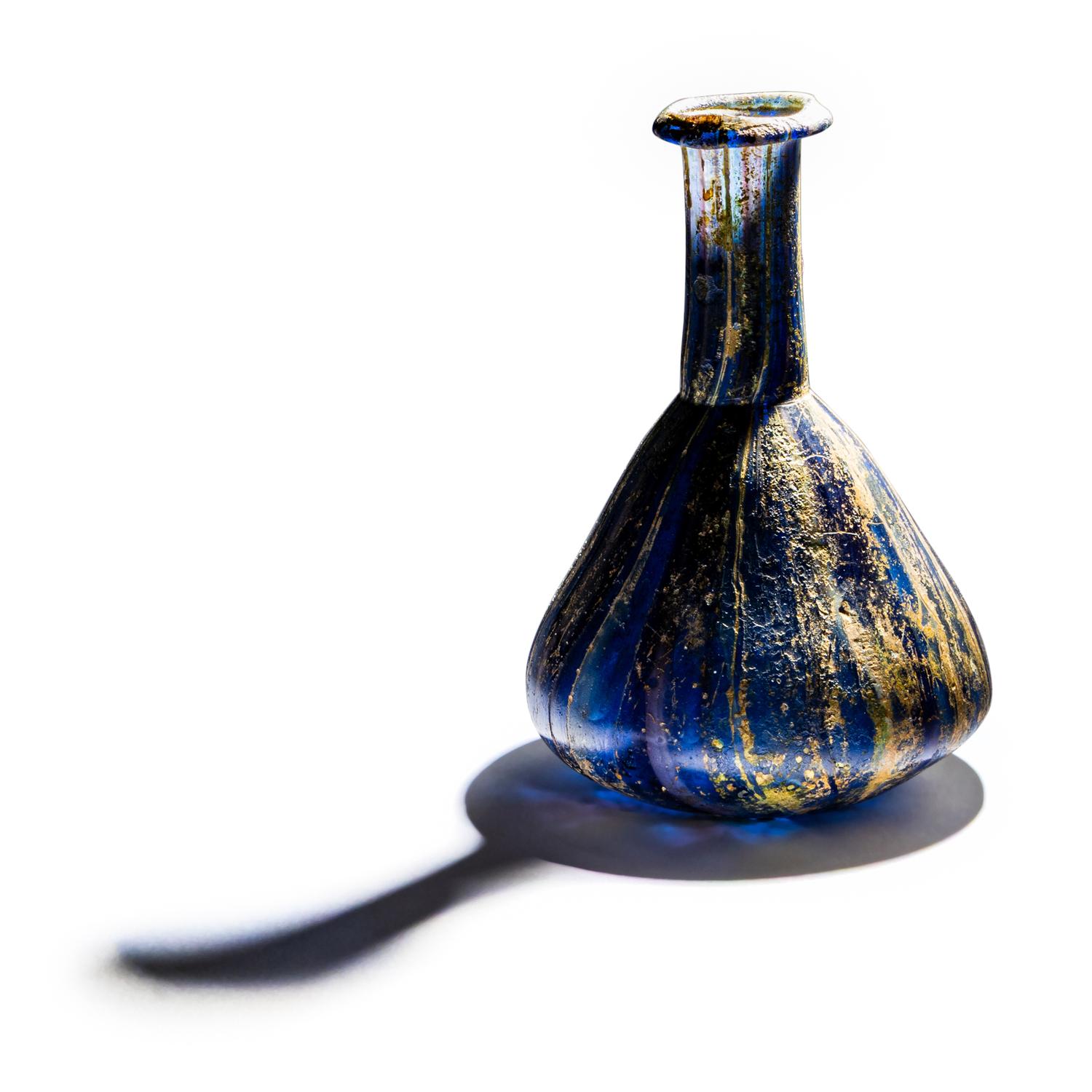 A Roman Marbled Glass Unguentarium