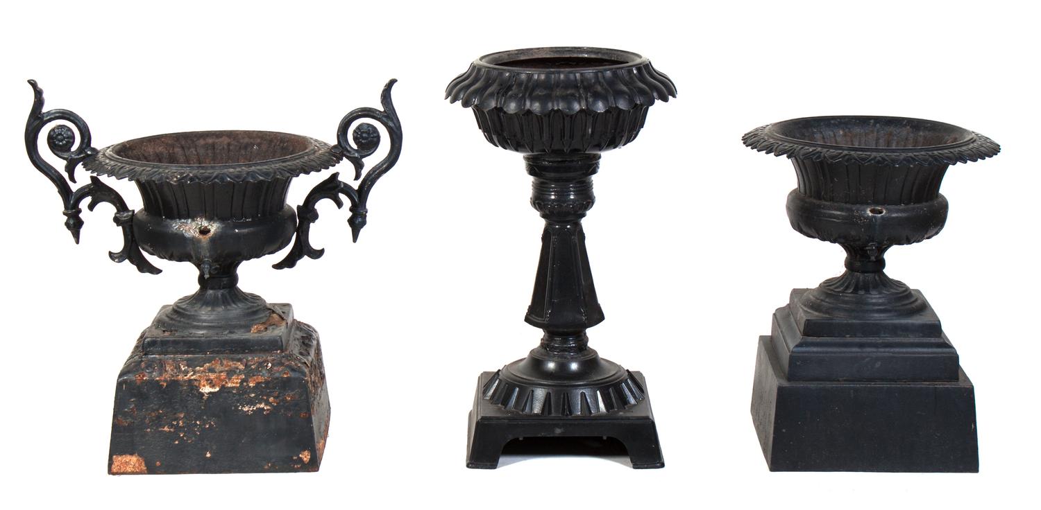 Three Cast Iron Garden Urns Height of tallest 32 1/2 inches.