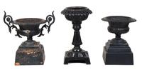 Three Cast Iron Garden Urns Height of tallest 32 1/2 inches.