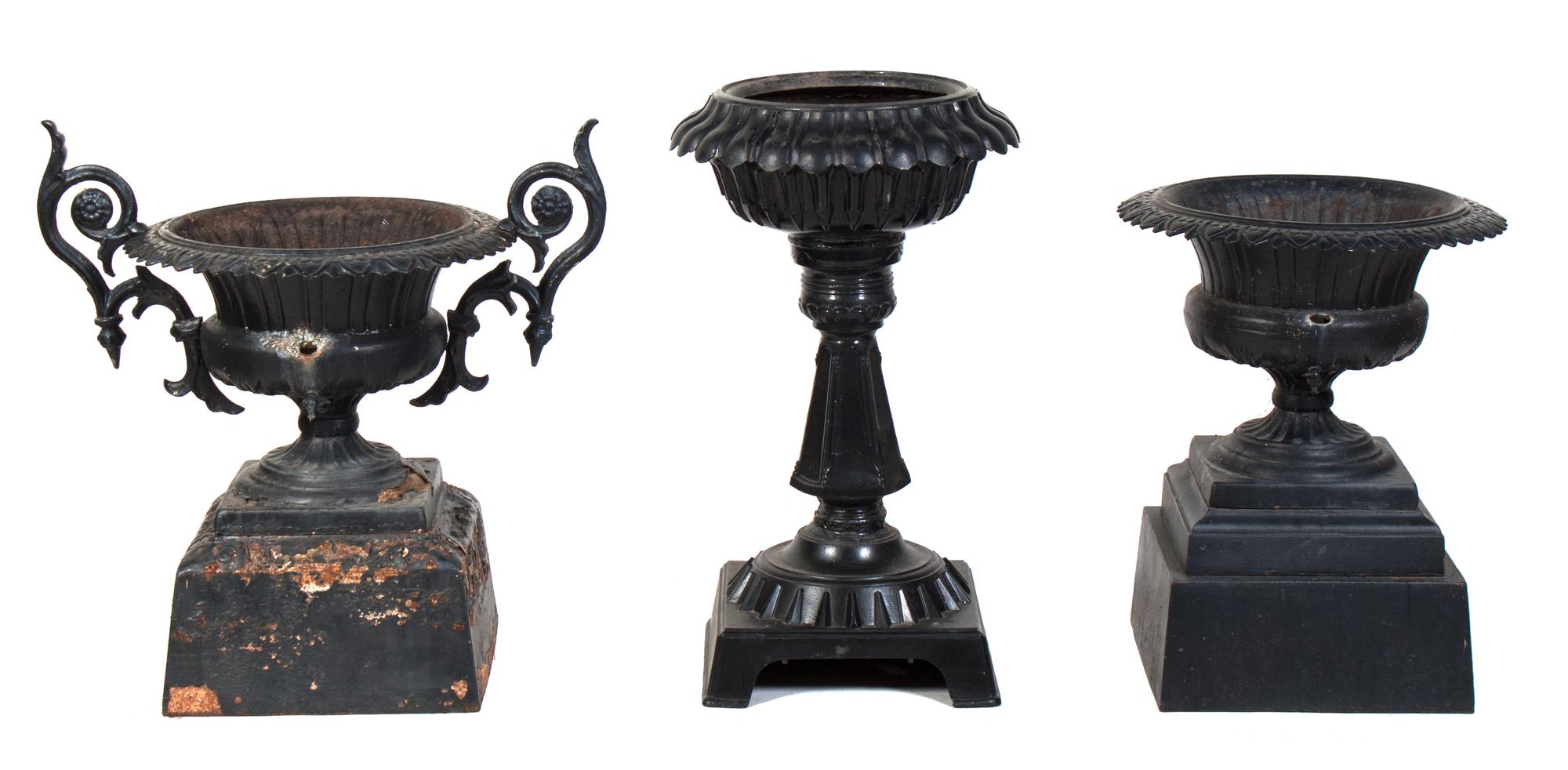Three Cast Iron Garden Urns Height of tallest 32 1/2 inches.
