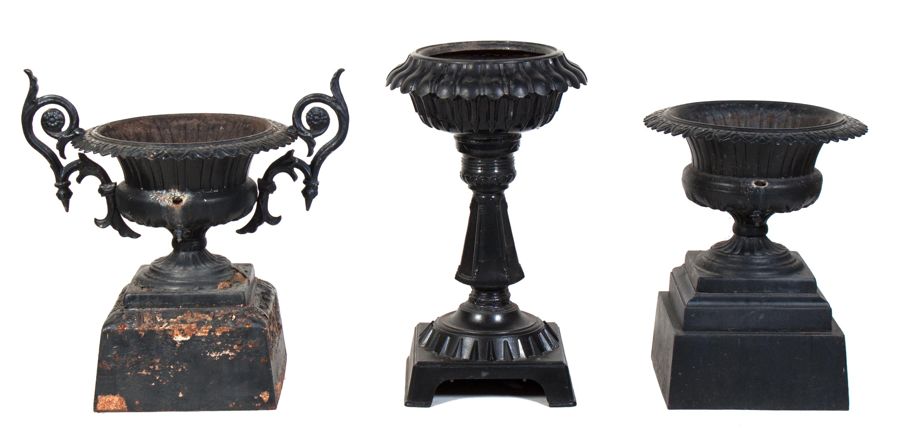Three Cast Iron Garden Urns Height of tallest 32 1/2 inches.