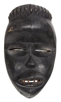 An African Carved Ceremonial Mask Height 11 3/4 inches. — 20TH CENTURY