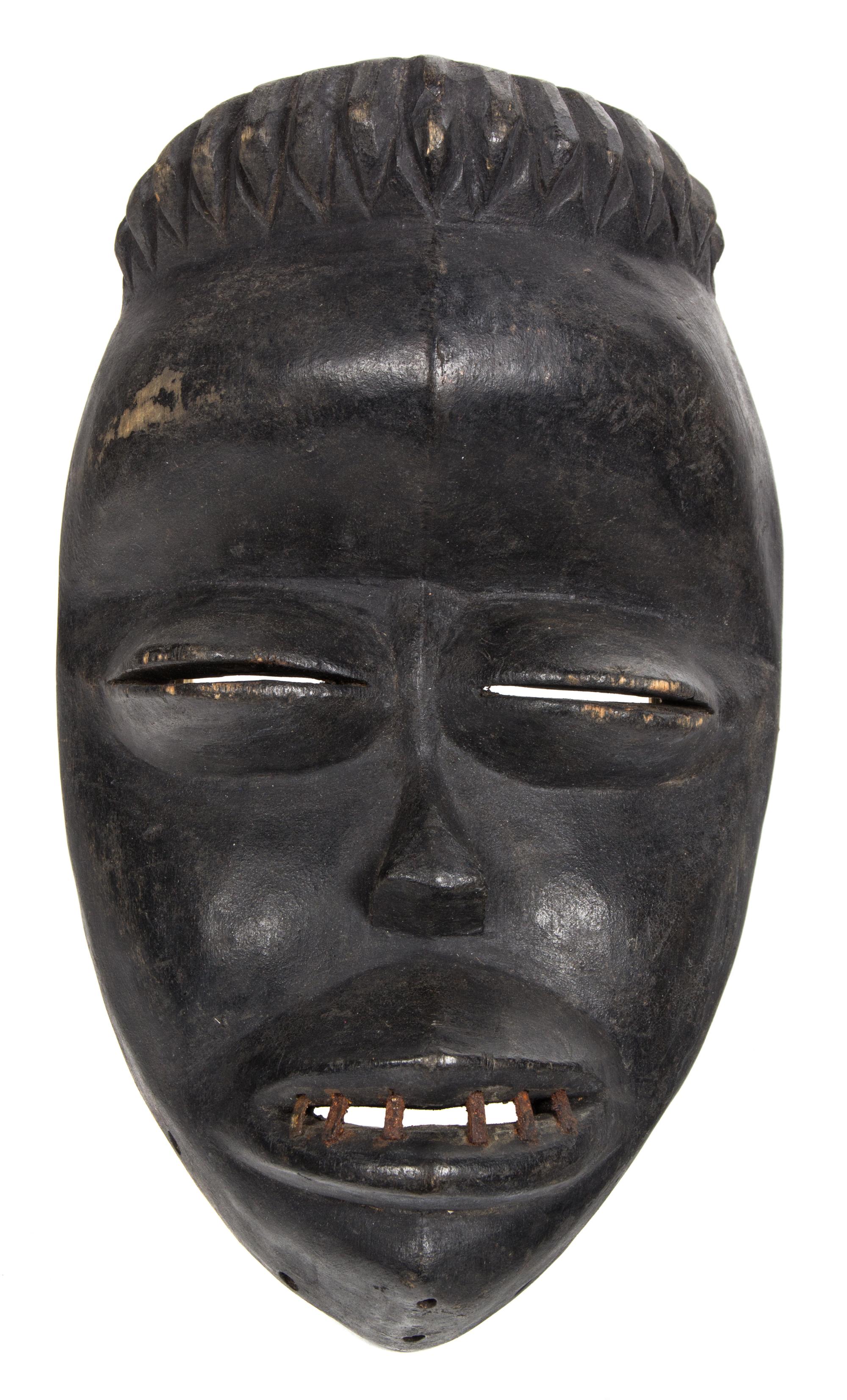 An African Carved Ceremonial Mask Height 11 3/4 inches. — 20TH CENTURY