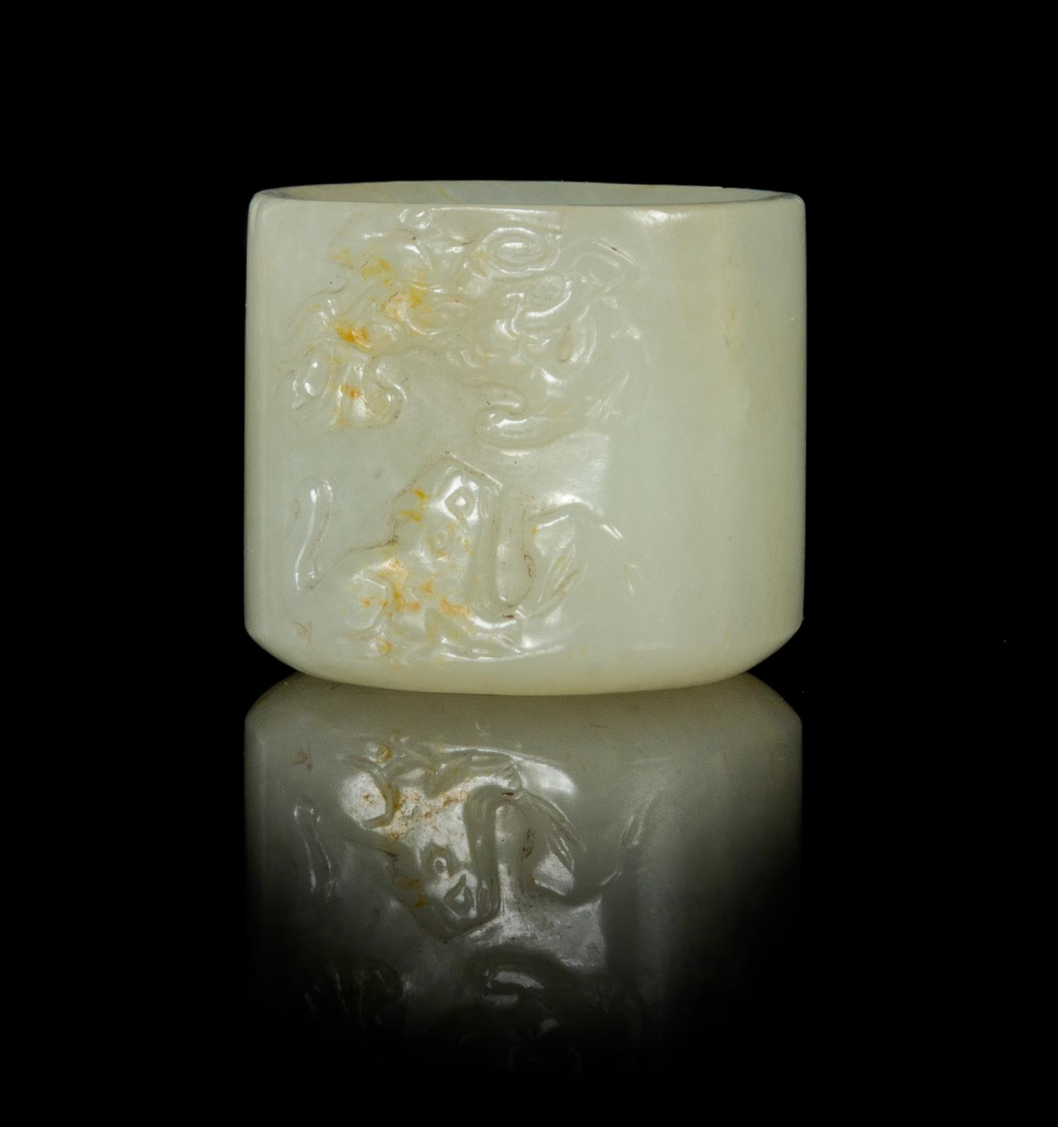 A Near-White Jade Archer's Ring Height 1 inch.