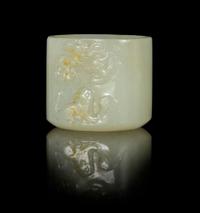 A Near-White Jade Archer's Ring Height 1 inch.