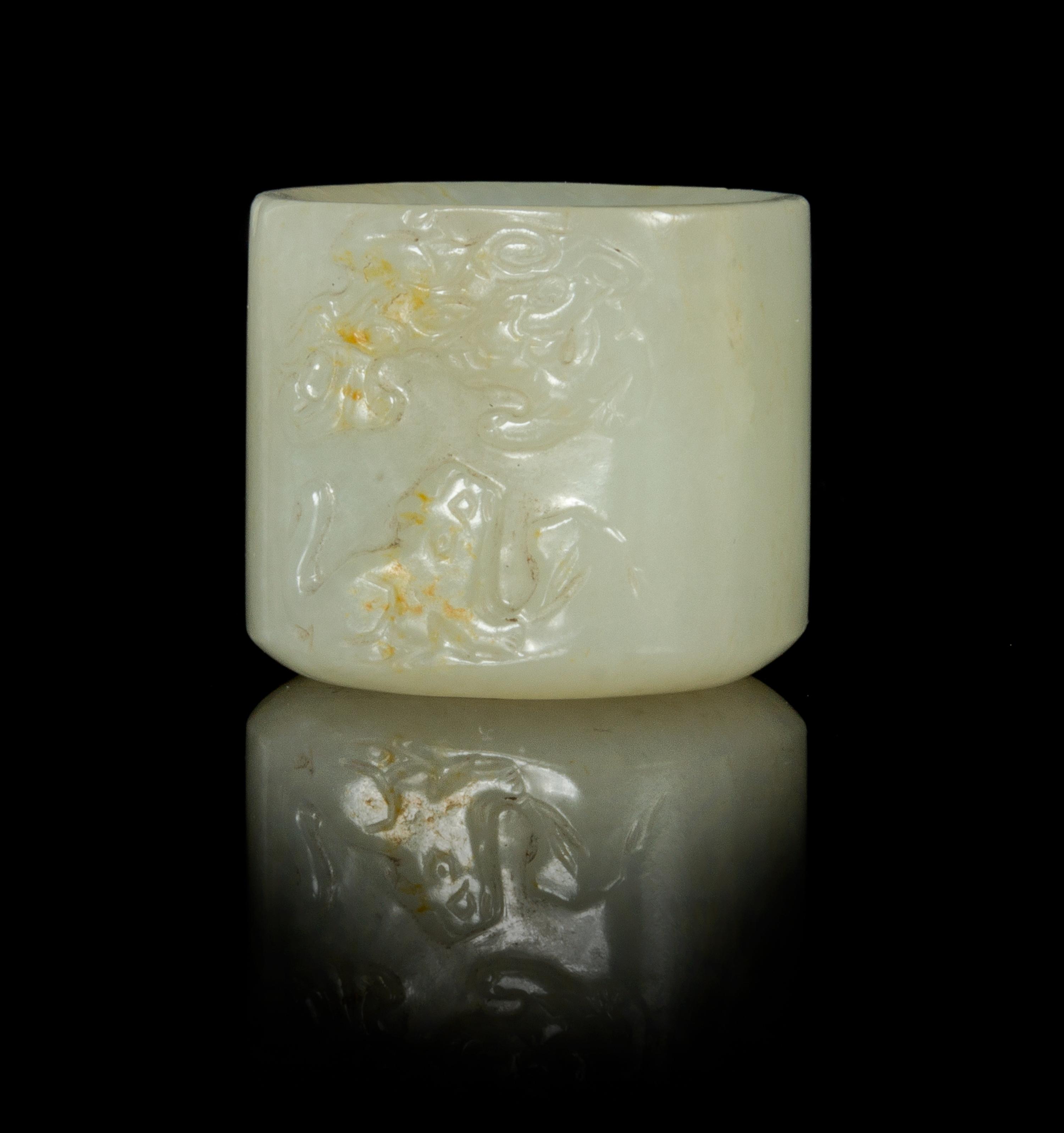 A Near-White Jade Archer's Ring Height 1 inch.