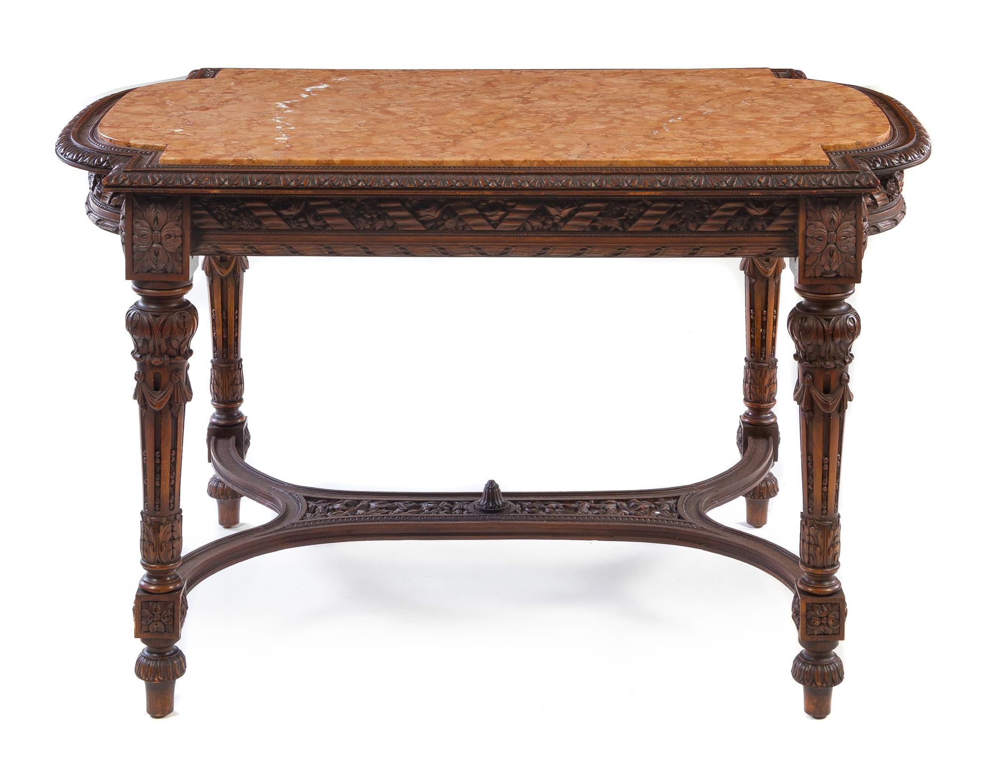 A Louis XVI Style Walnut Center Table Height 31 1/4 x width 51 x depth 32 1/4 inches. — LATE 19TH CENTURY