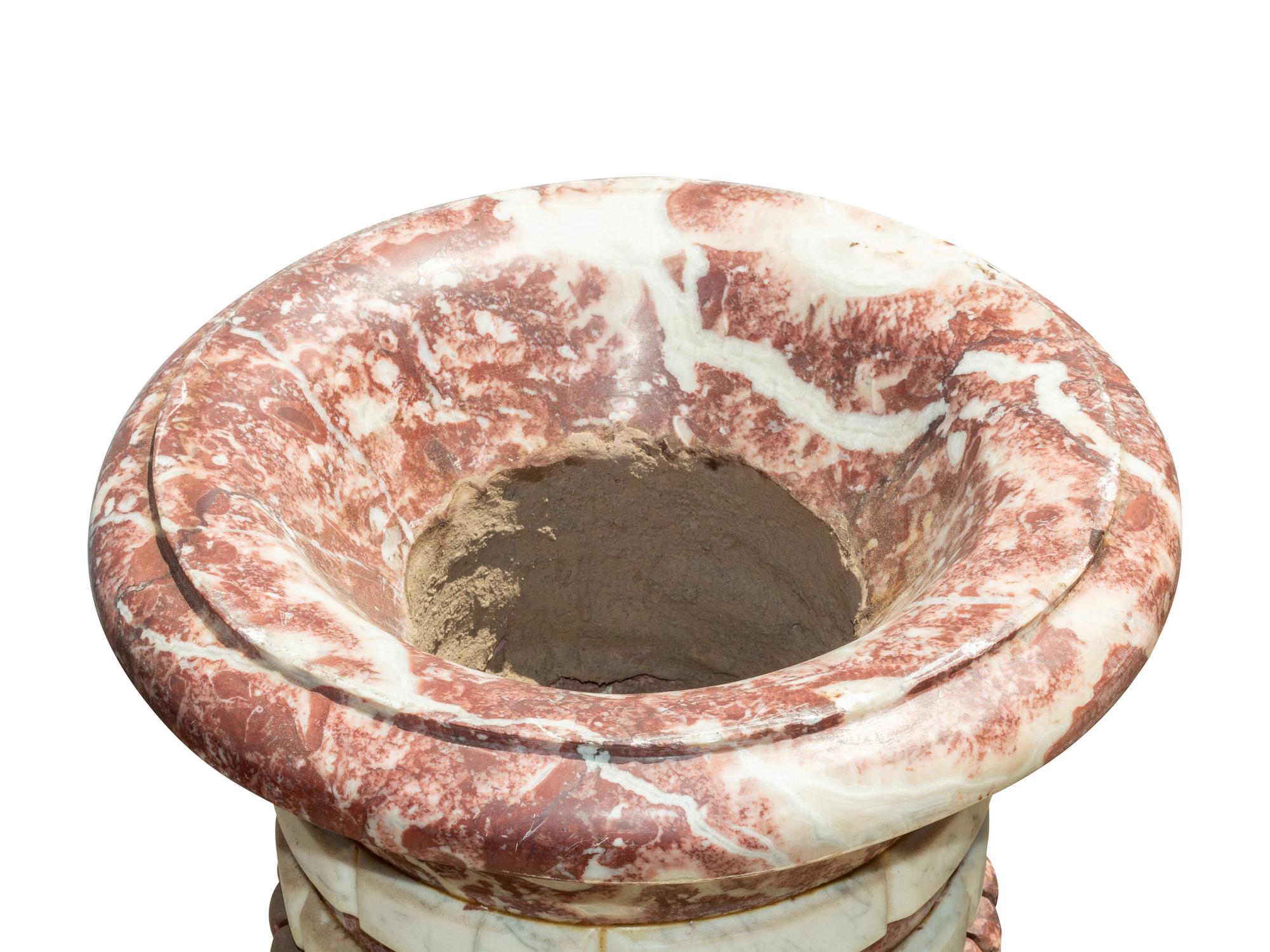 A Set of Four Italian Carved Red and White Marble Urns