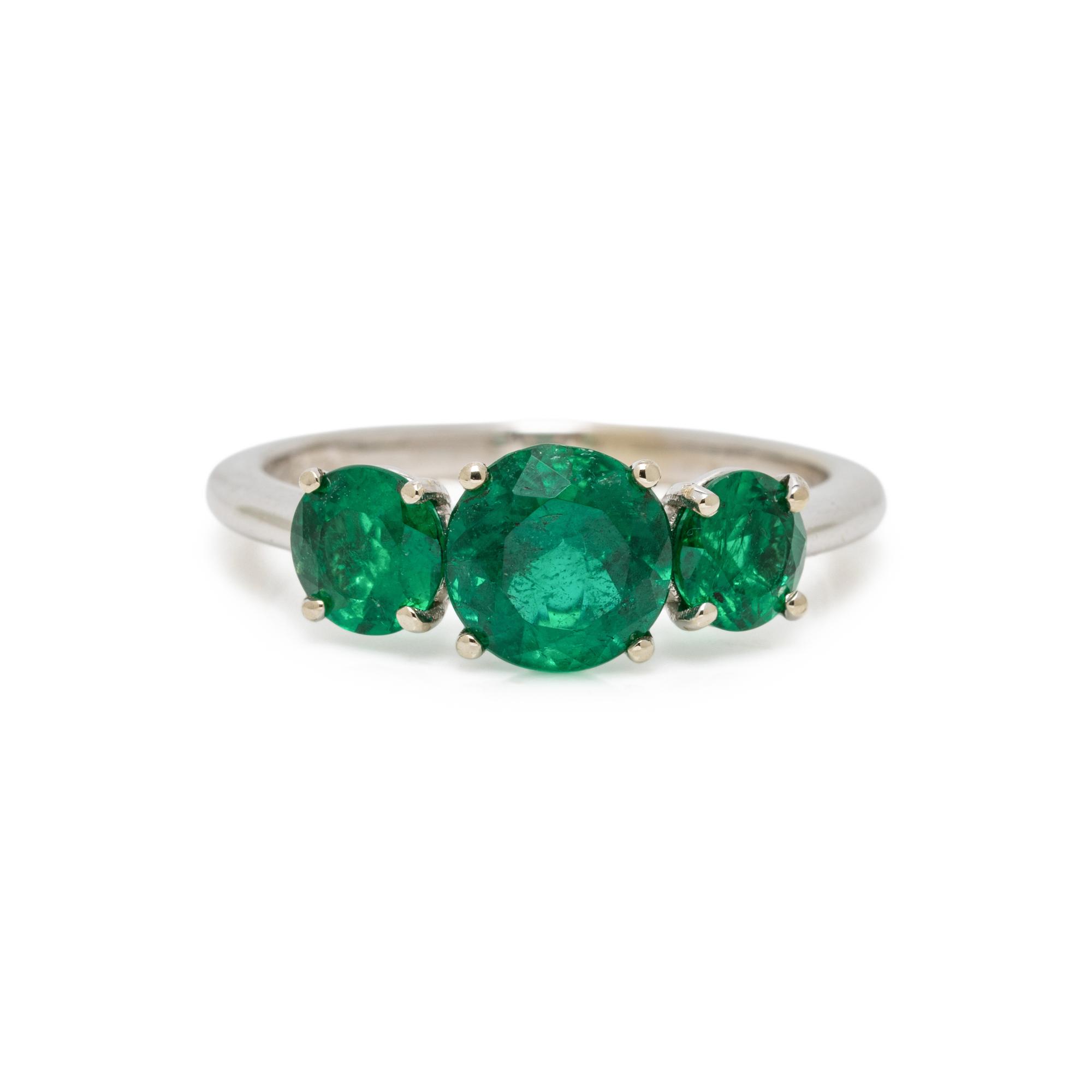 THREE STONE EMERALD AND WHITE GOLD RING