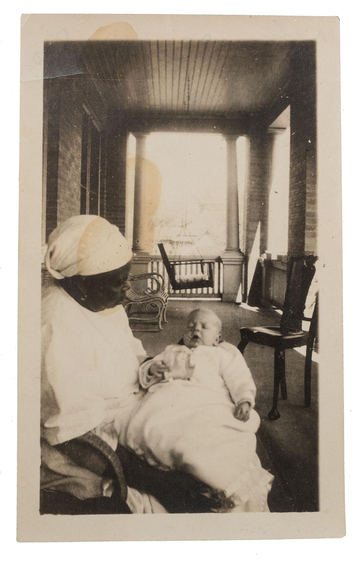 [EARLY PHOTOGRAPHY]. A pair of portraits of African American subjects holding white babies.