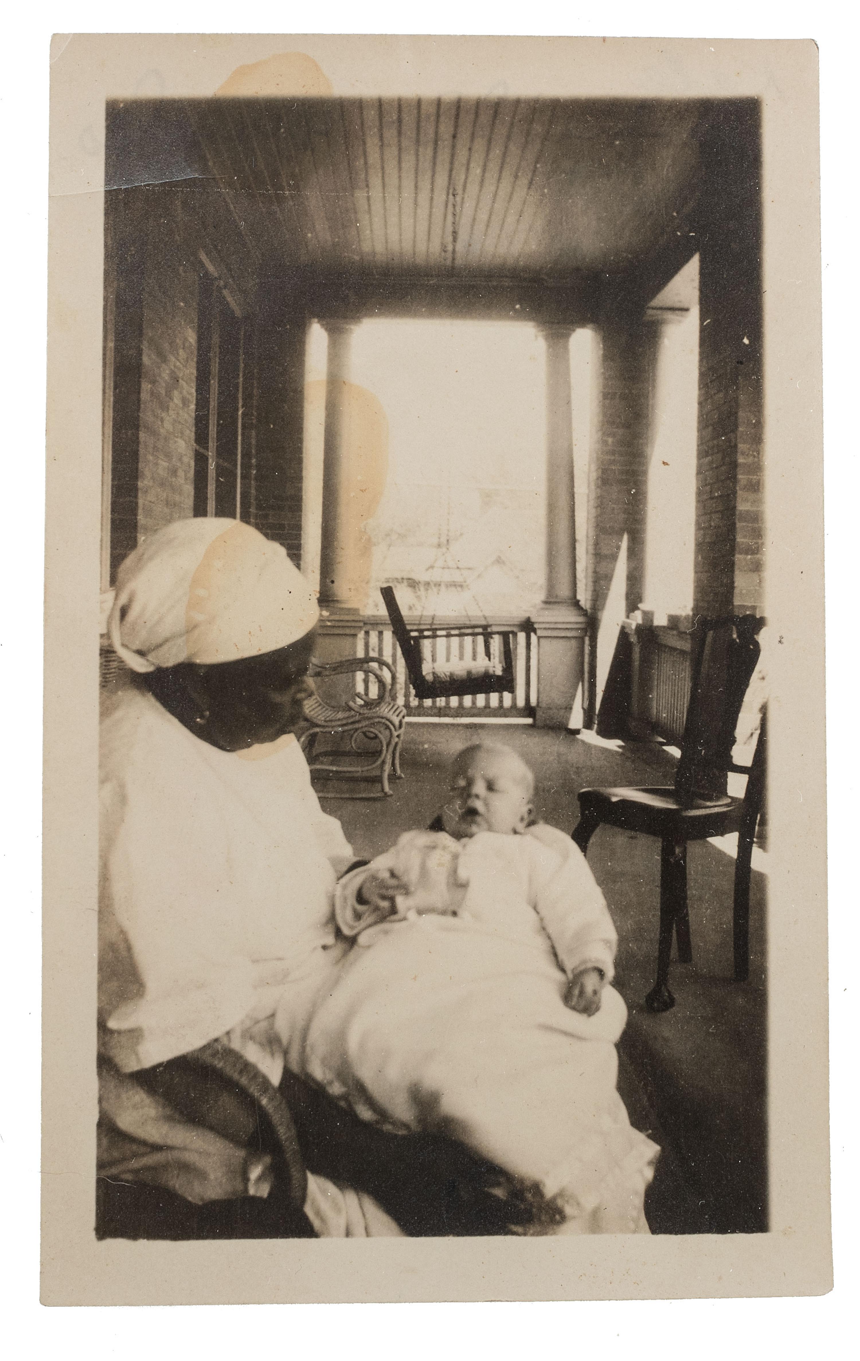 [EARLY PHOTOGRAPHY]. A pair of portraits of African American subjects holding white babies.