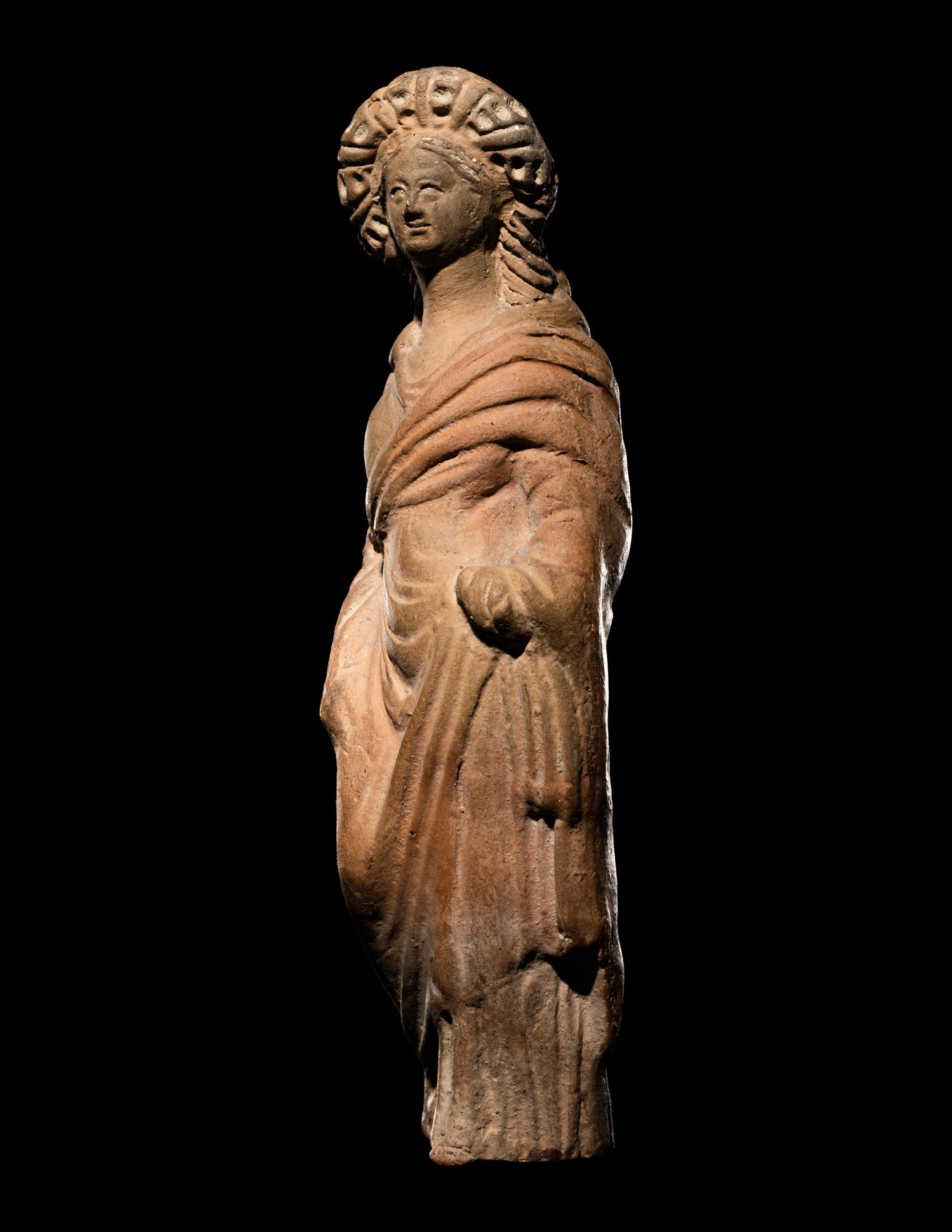 A Greek Terracotta Standing Draped Female