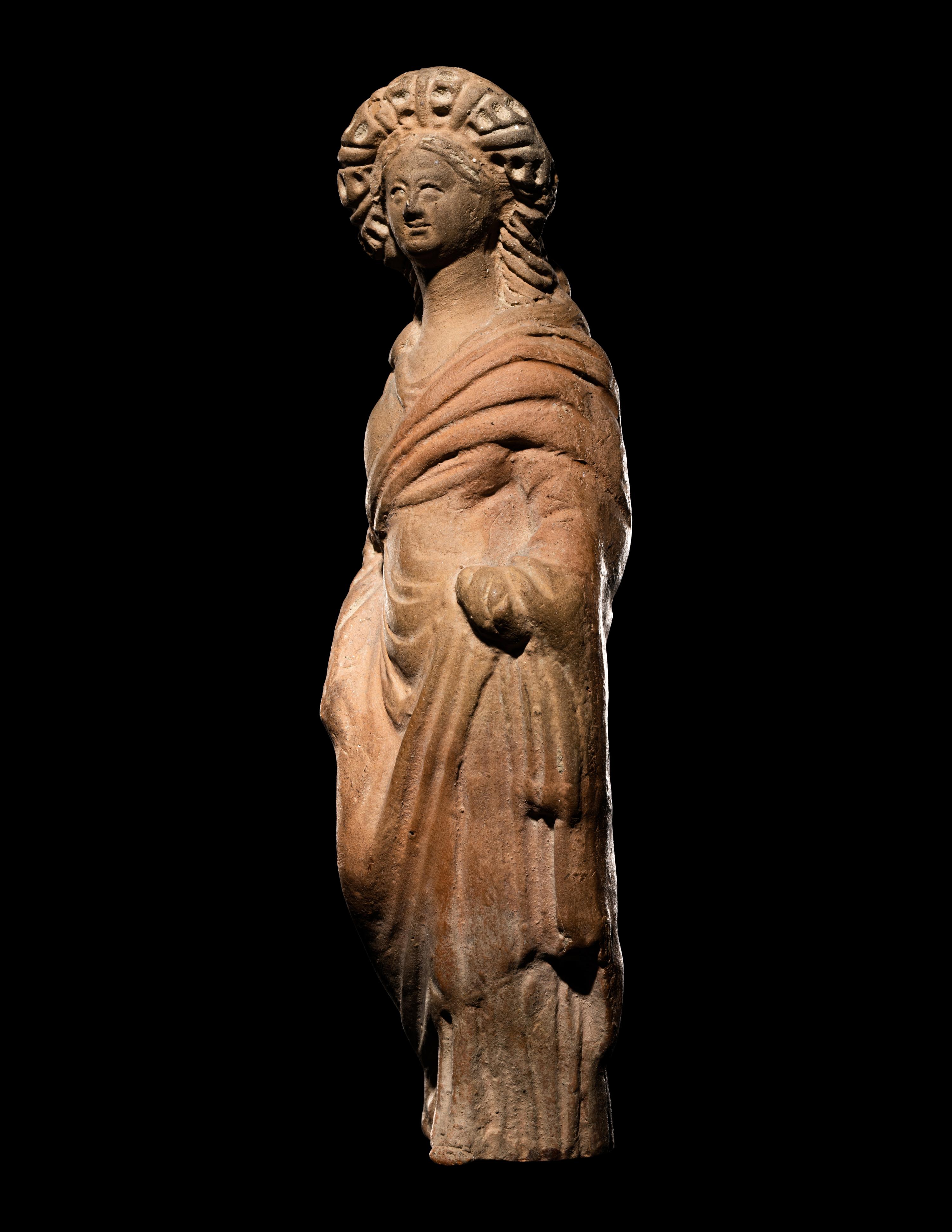 A Greek Terracotta Standing Draped Female