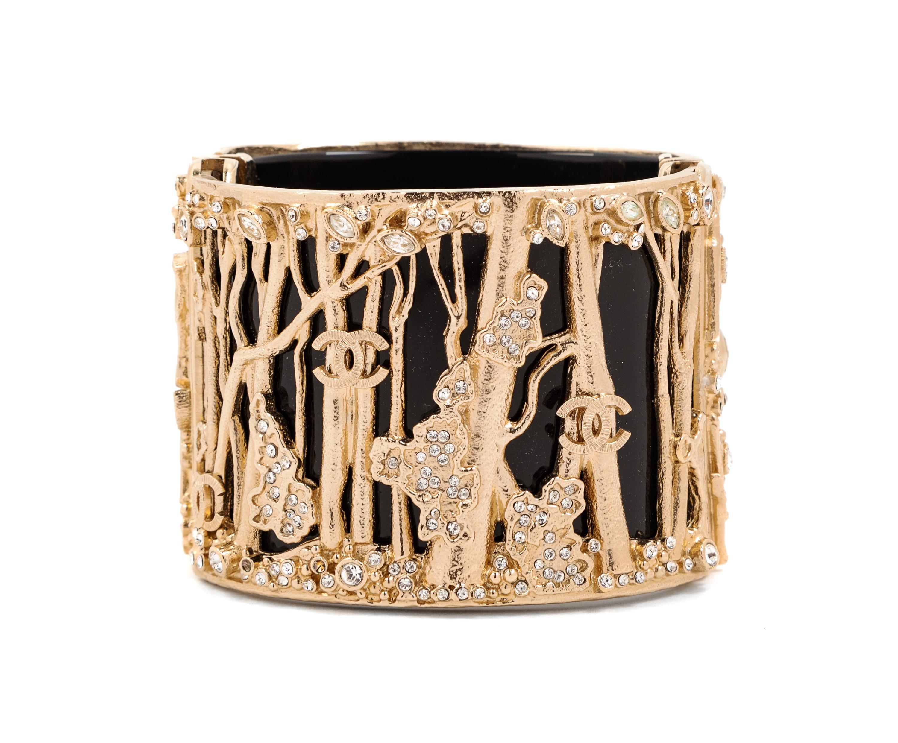 A Chanel Black Resin Goldtone Wide Cuff Bracelet, 2011 Width: 2"