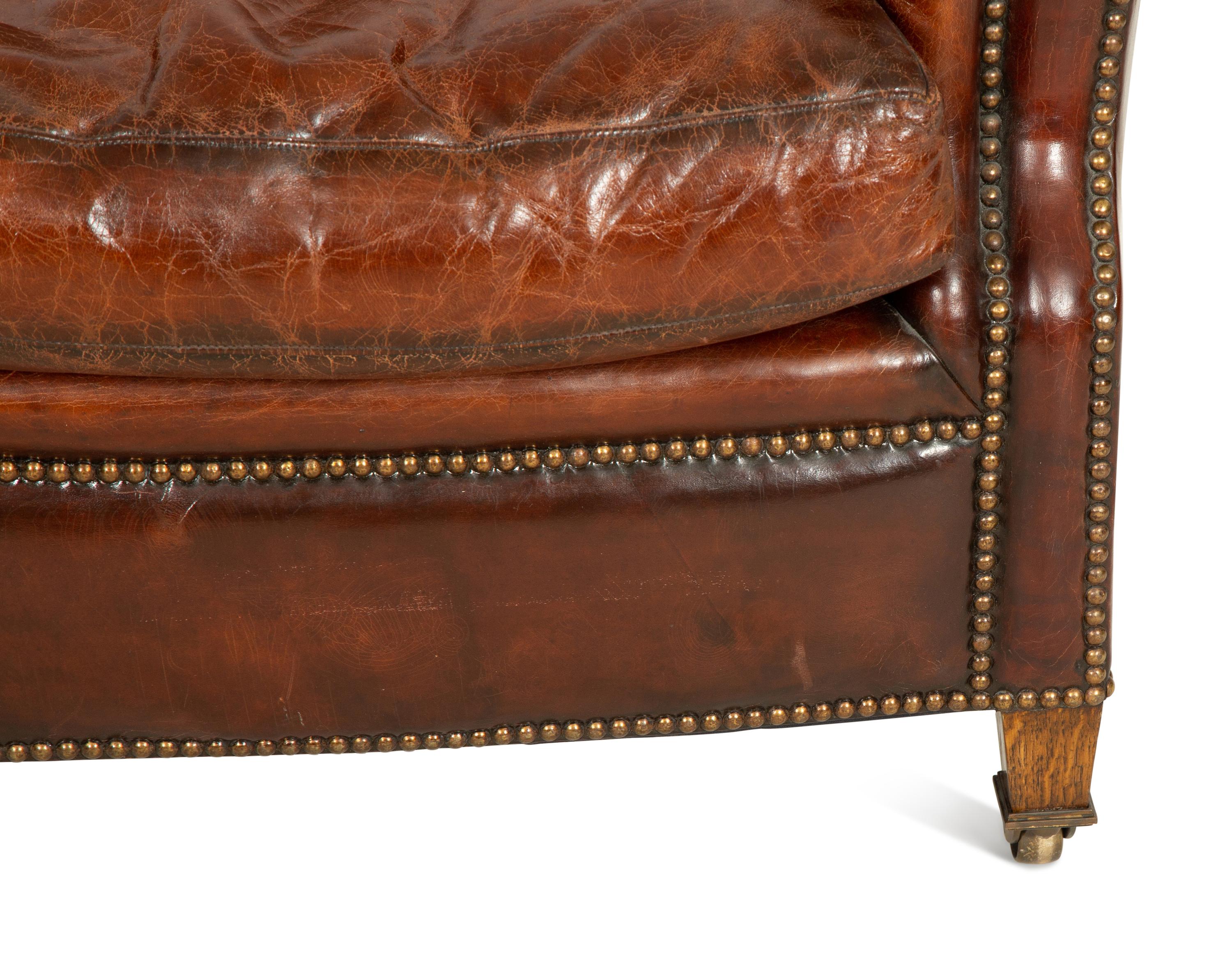 A Pair of Chesterfield Style Leather Club Chairs