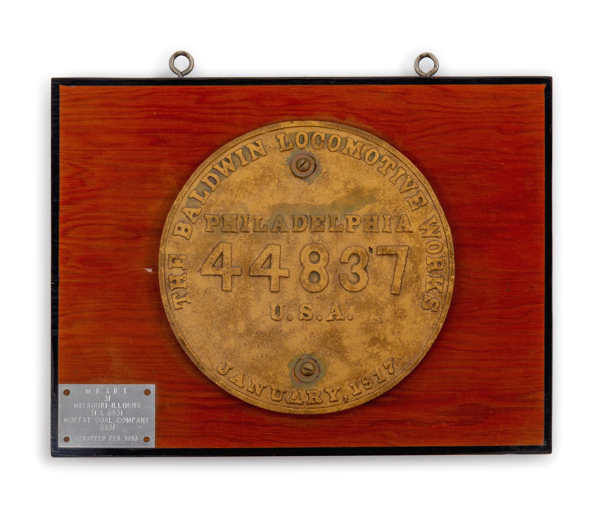A Painted Metal Baldwin Locomotive Co.: Philadelphia Locomotive Badge and Engine Number Plaque for the M.R. & B.T. Railroad