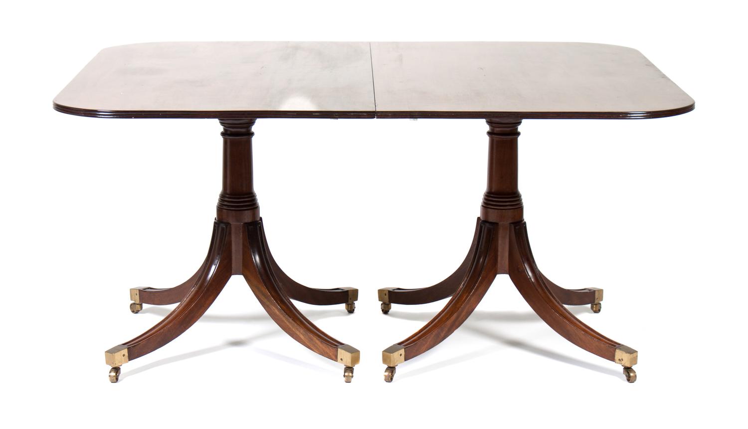 A Sheraton Style Mahogany Dining Table Height 28 1/2 x length 72 1/2 x depth 47 1/2 inches.
