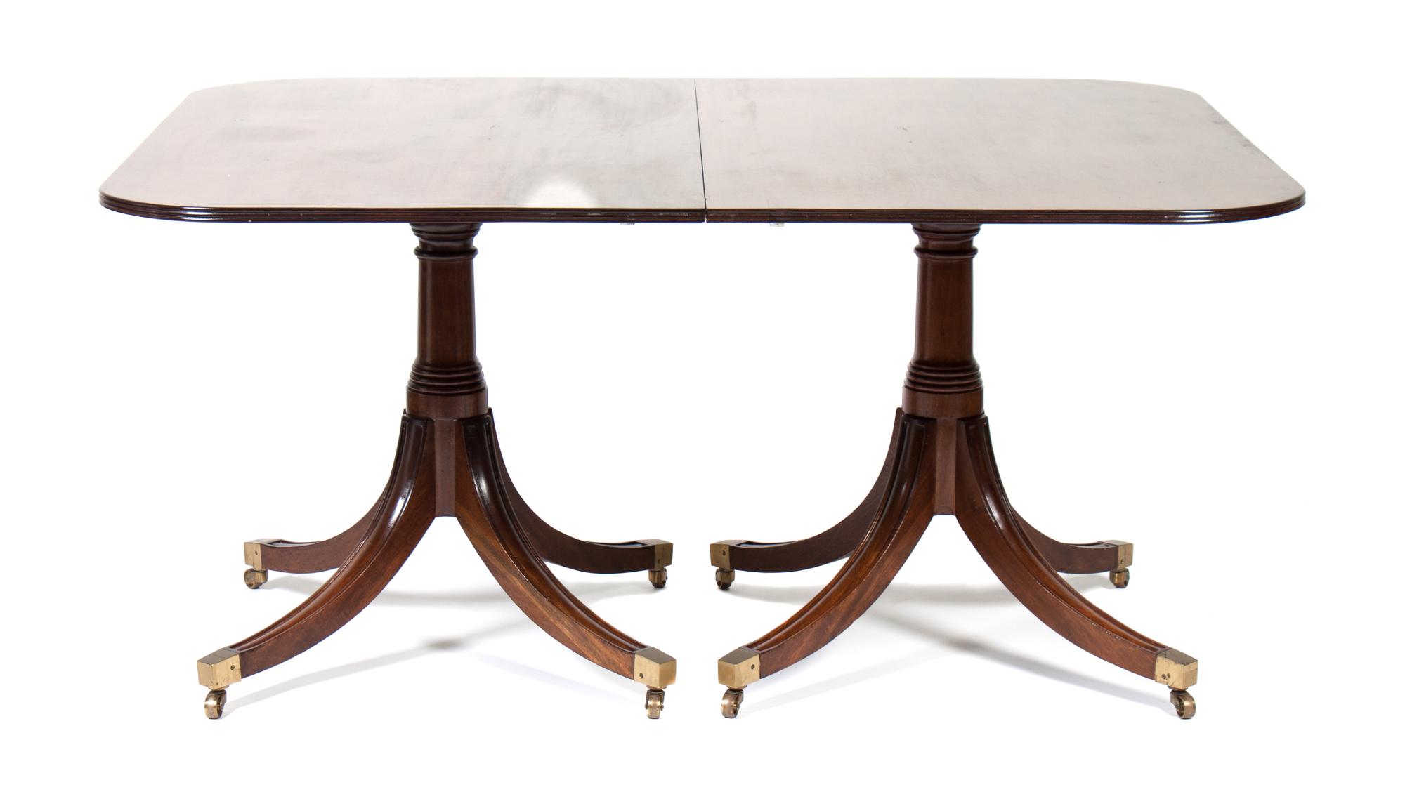 A Sheraton Style Mahogany Dining Table Height 28 1/2 x length 72 1/2 x depth 47 1/2 inches.