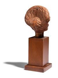 An Egyptian Terracotta Head of a Woman