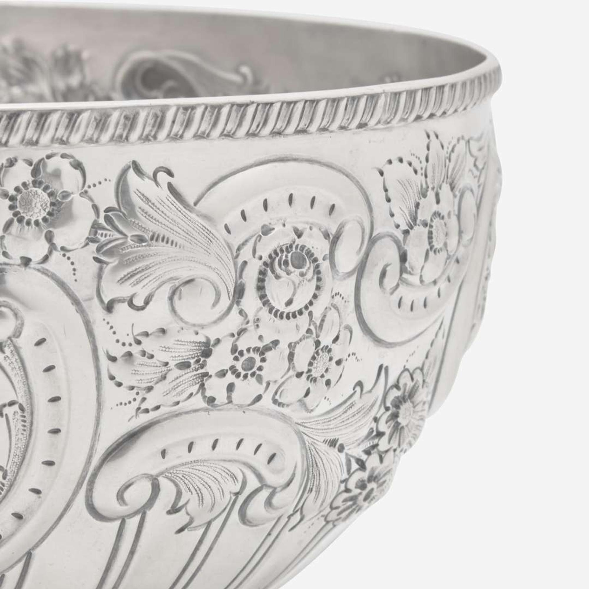 A Victorian sterling silver repoussé punch bowl William Hutton & Sons Ltd., London, 1899