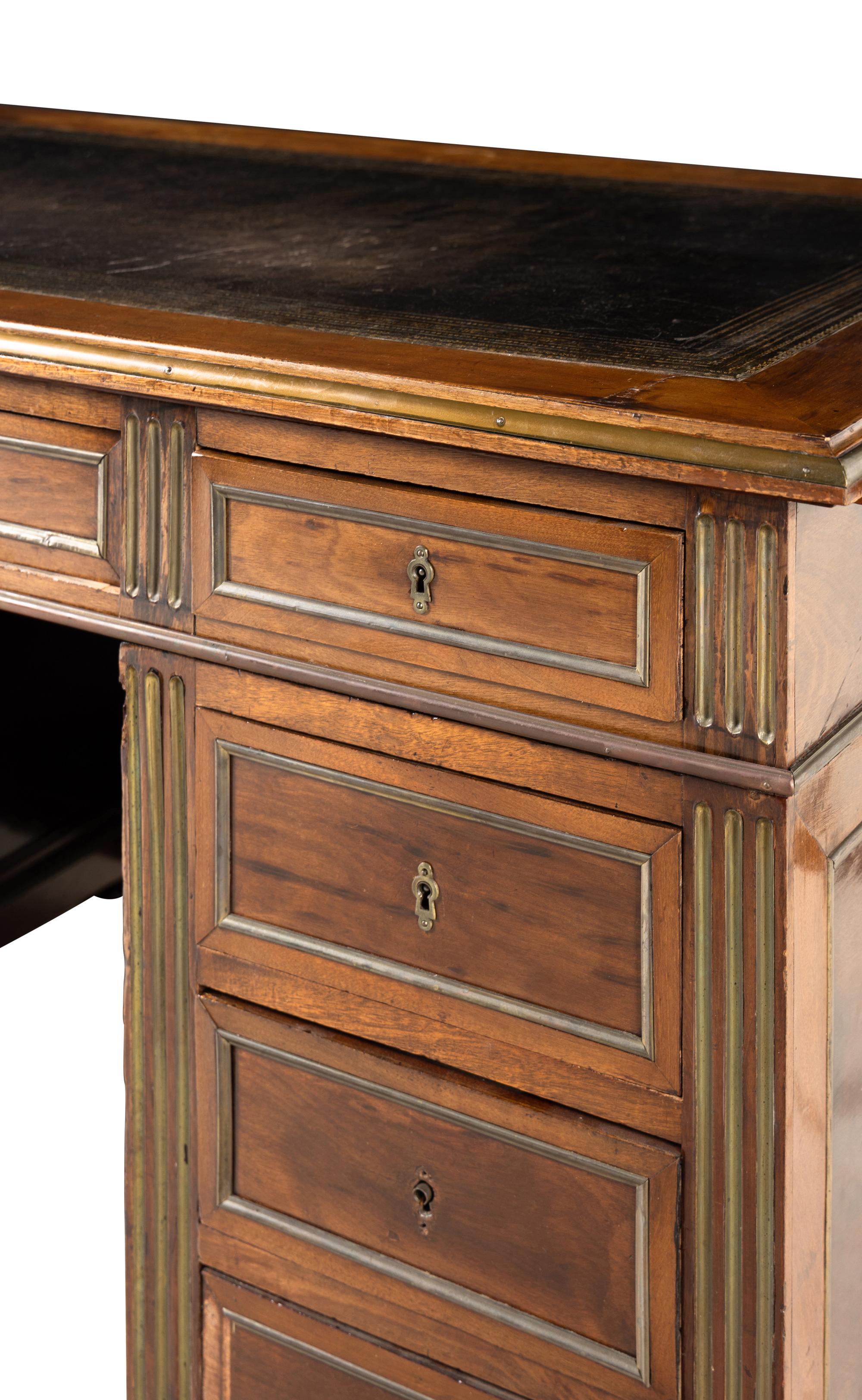 A Directoire Style Brass Mounted Mahogany Pedestal Desk