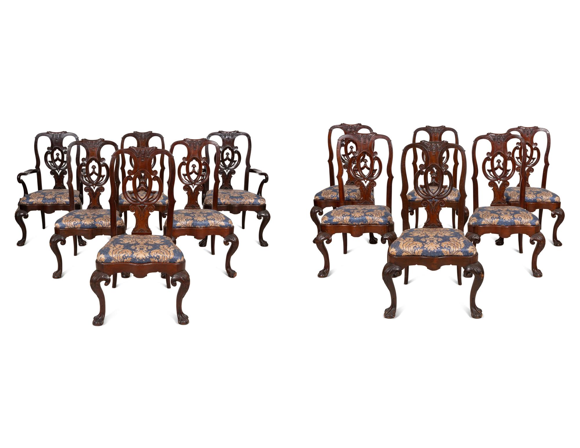 A Set of Twelve Continental Walnut Dining Chairs