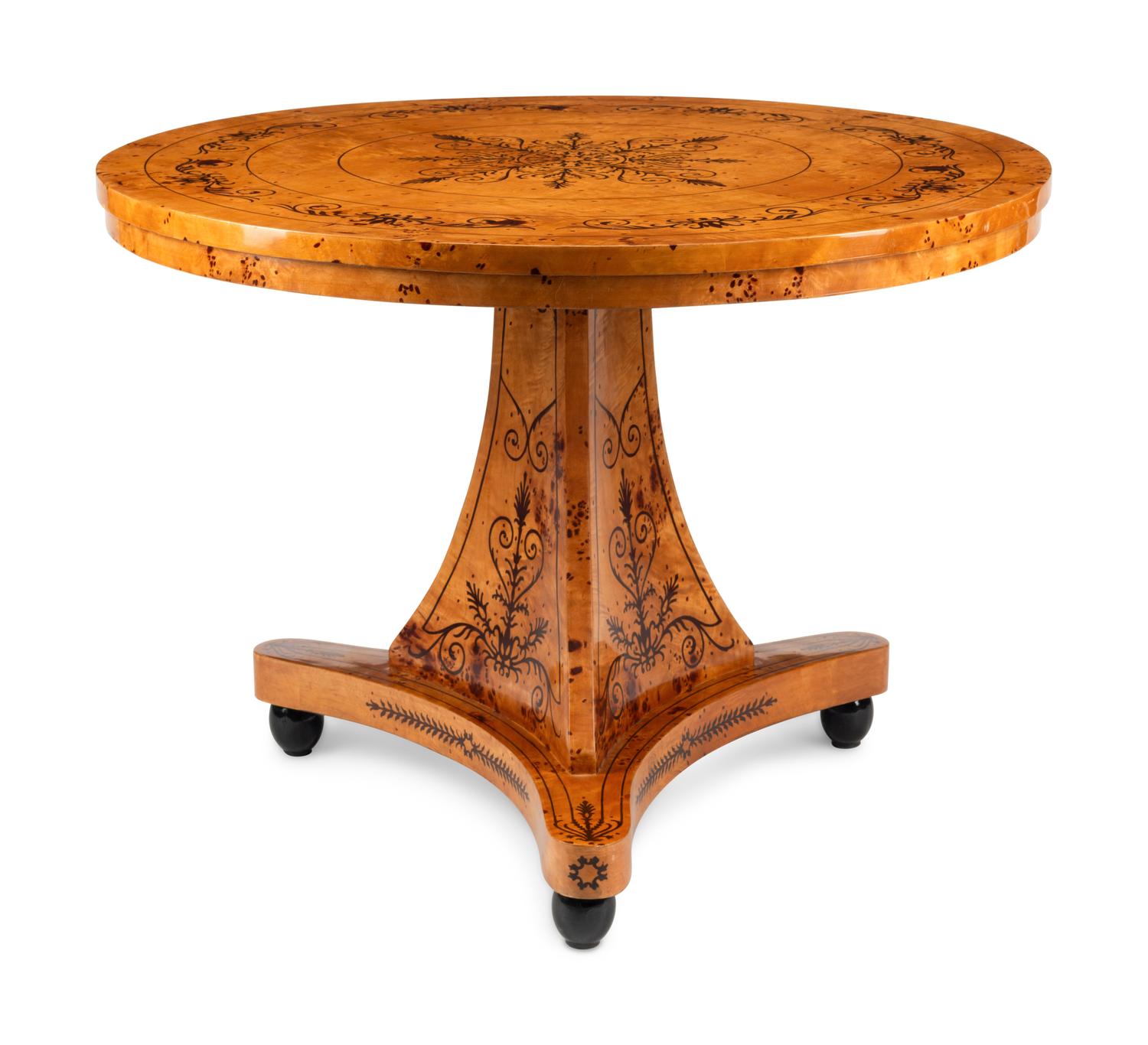 A Charles X Style Burlwood and Marquetry Center Table