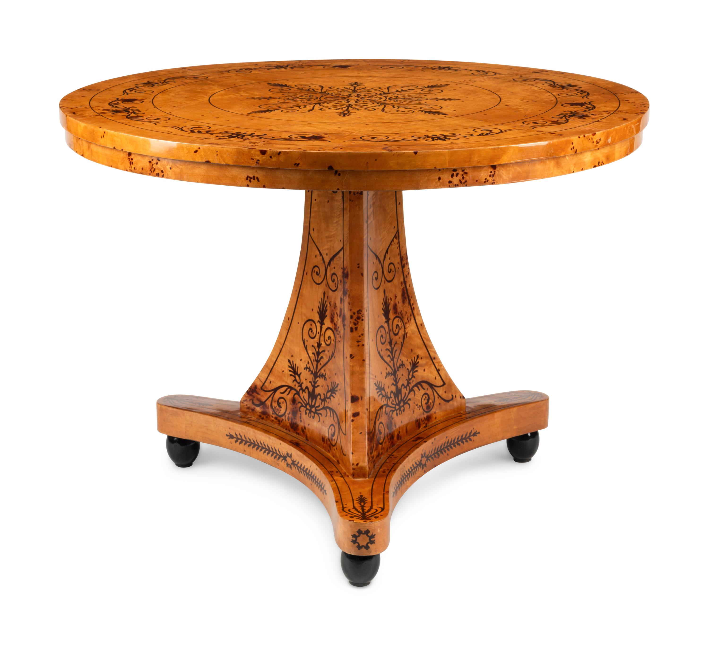 A Charles X Style Burlwood and Marquetry Center Table