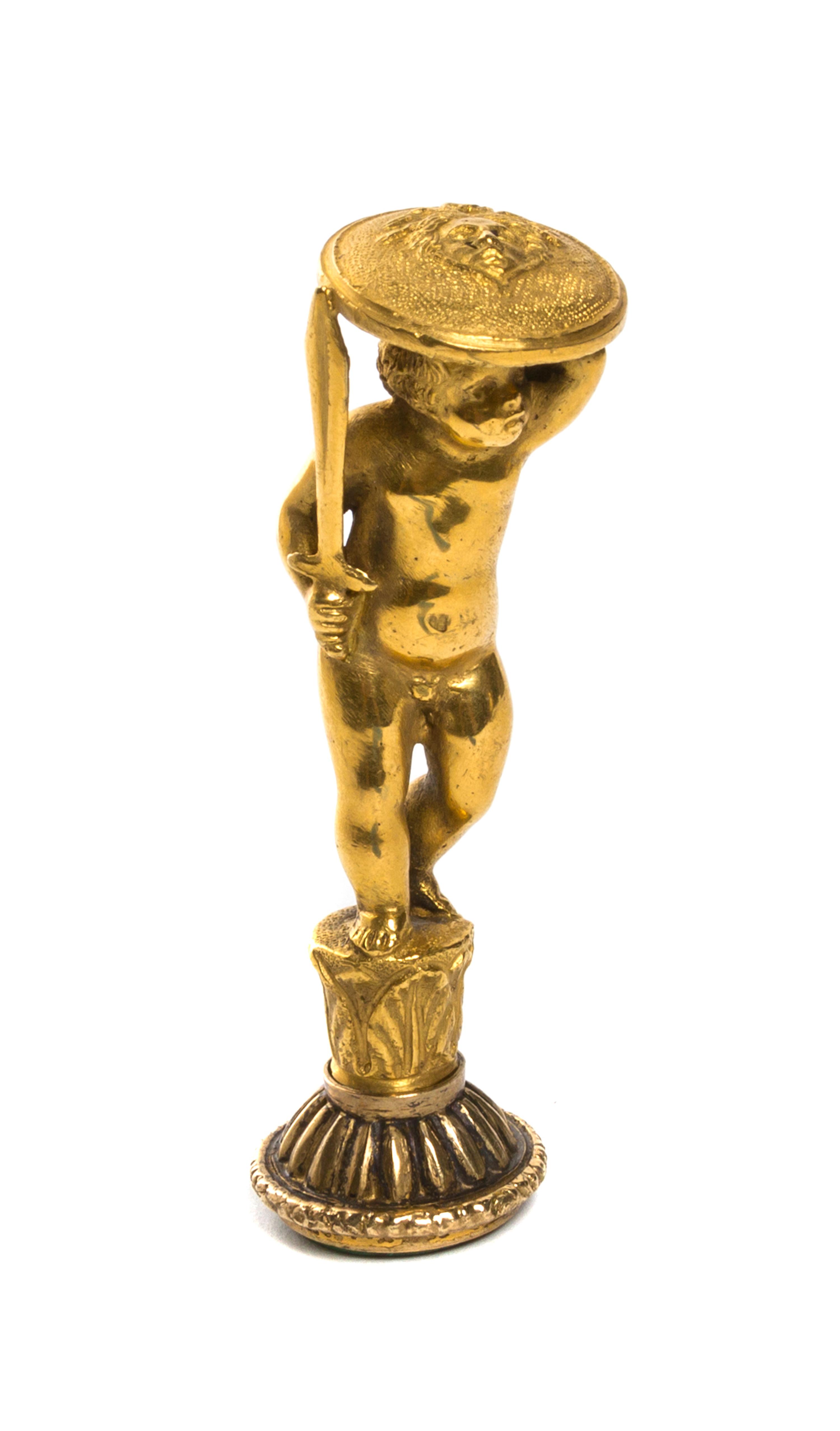 A Continental Gilt Metal Figural Seal, Height 3 7/8 inches.