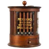 A Merrick's Six Cord Cylindrical Spool Cabinet