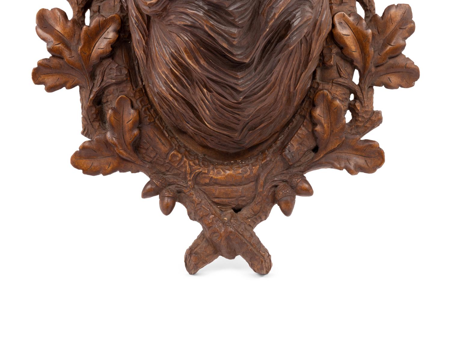A Black Forest Carved Stag Head