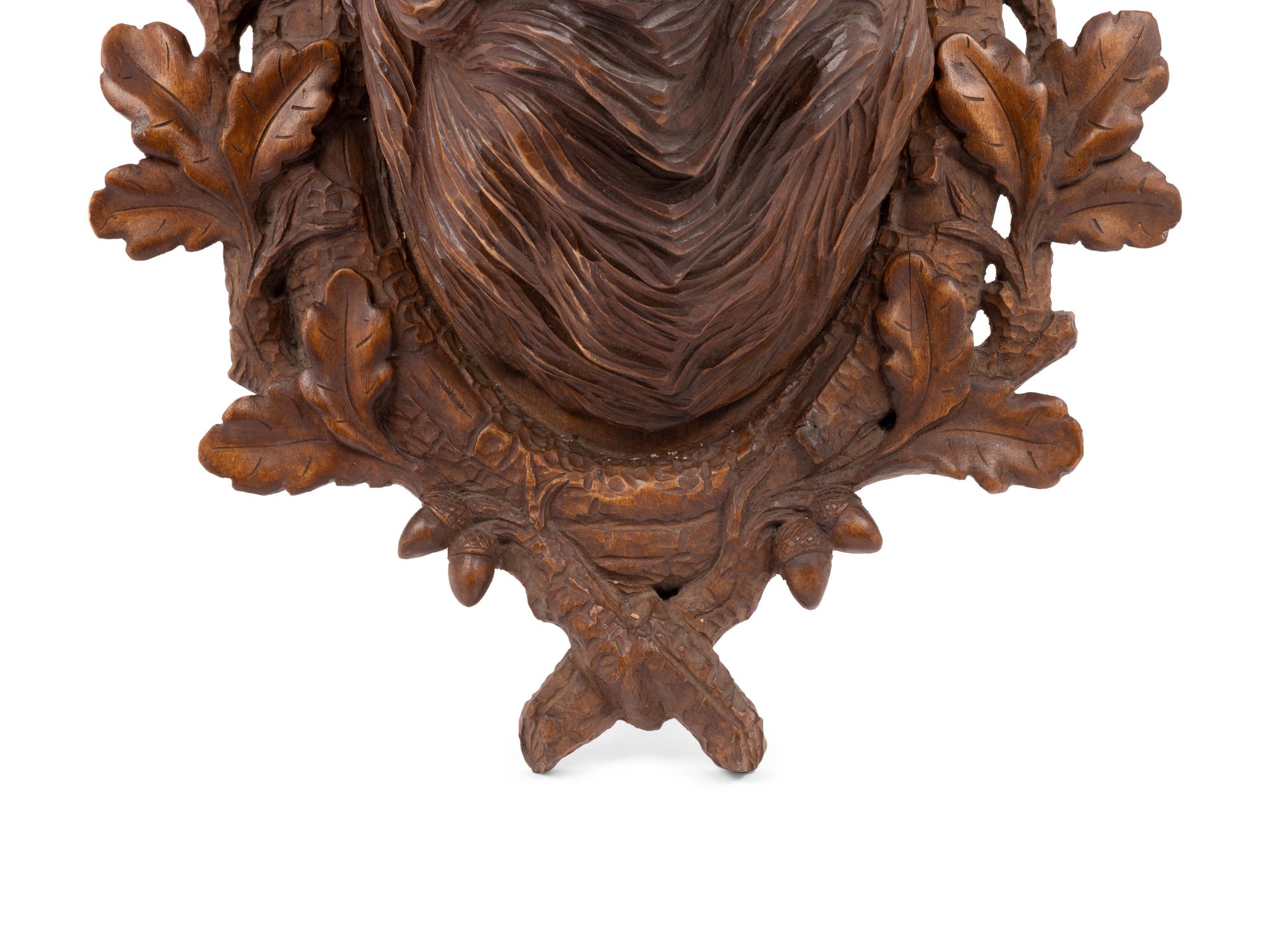 A Black Forest Carved Stag Head