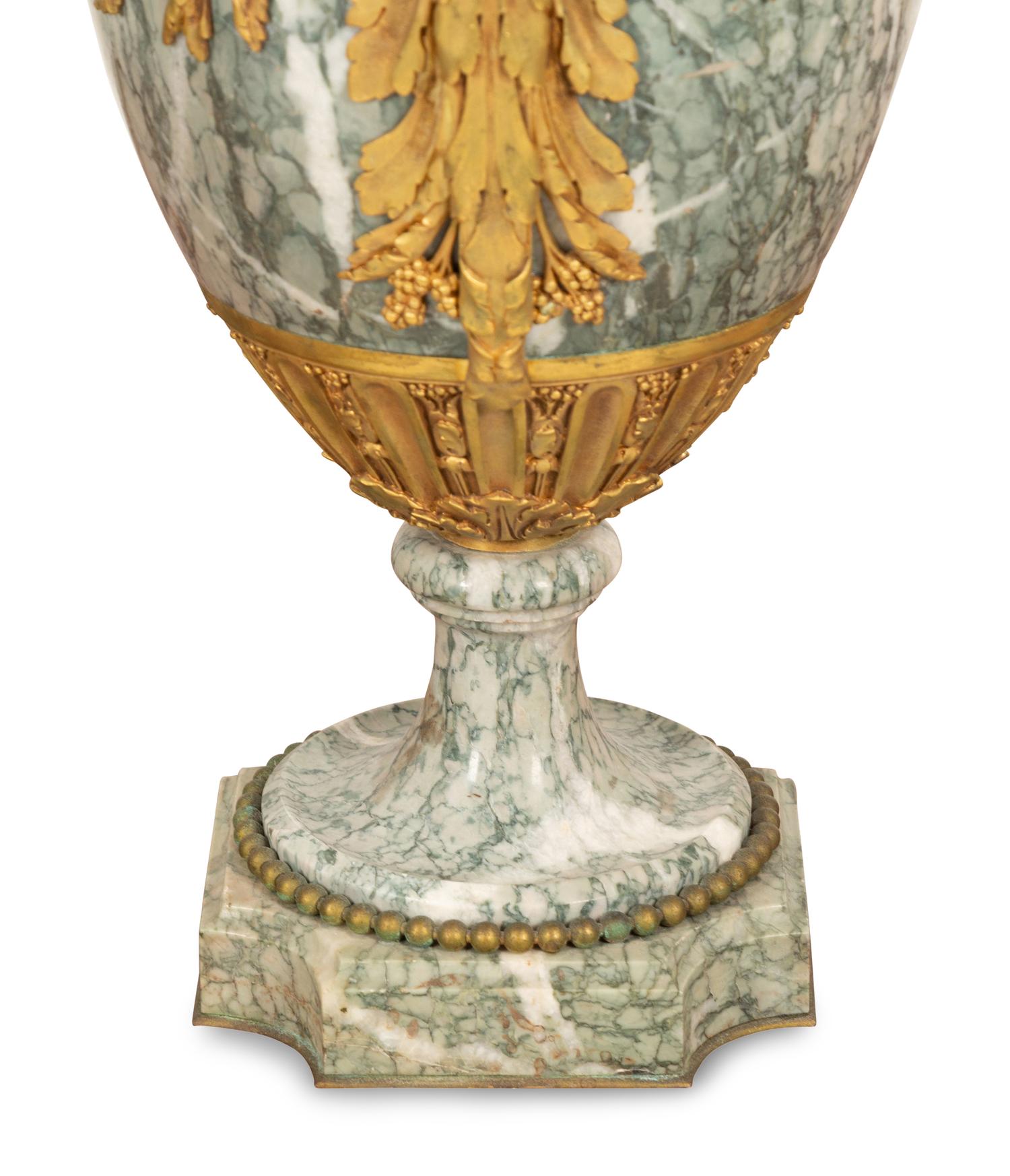 A Pair of Louis XV Style Gilt Bronze and Marble Five-Light Candelabra