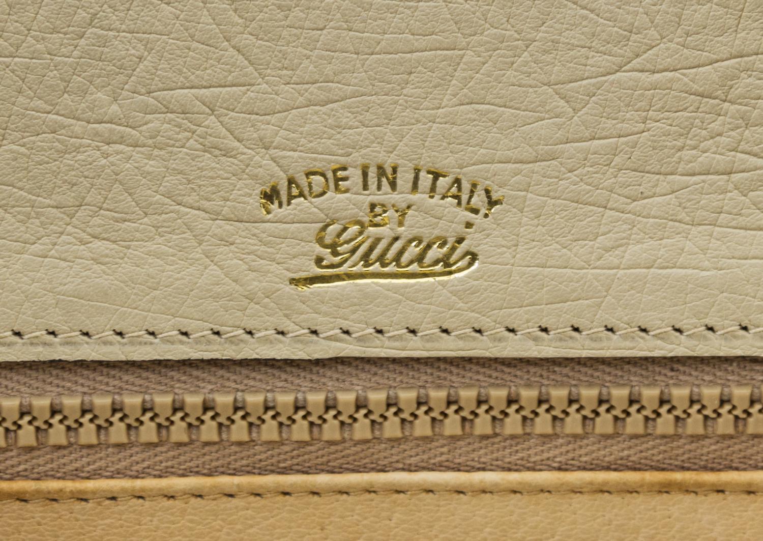 A Gucci Cream Ostrich Bamboo Top Handle Bag, 10.5" x 7.5" x 3".
